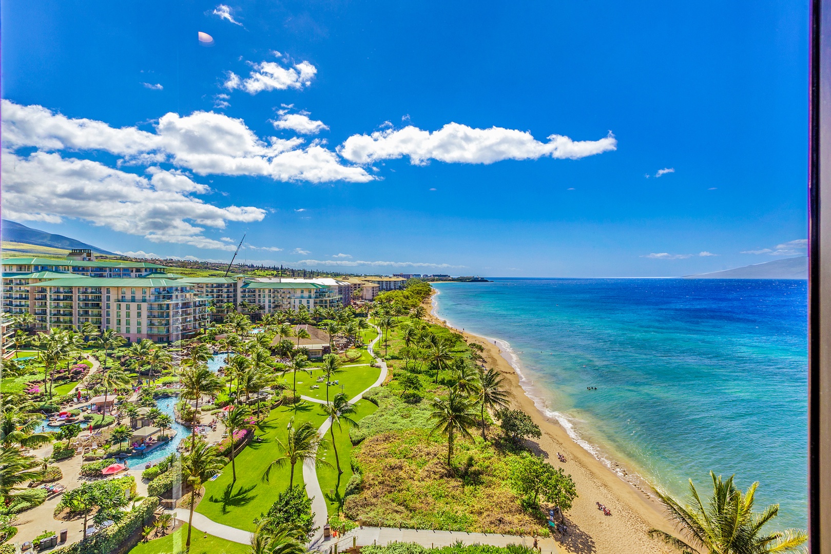 Lahaina Vacation Rentals, Mahana 1119 - This stunning aerial view showcases the pristine coastline and lush tropical landscape, offering a perfect escape to the beauty of Hawaii.