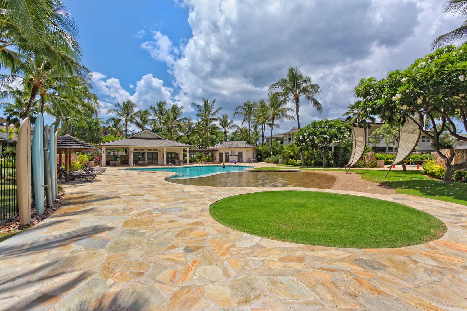 Kapolei Vacation Rentals, Coconut Plantation 1208-2 - This pool also includes a sand bottom pool area under swaying palm trees.