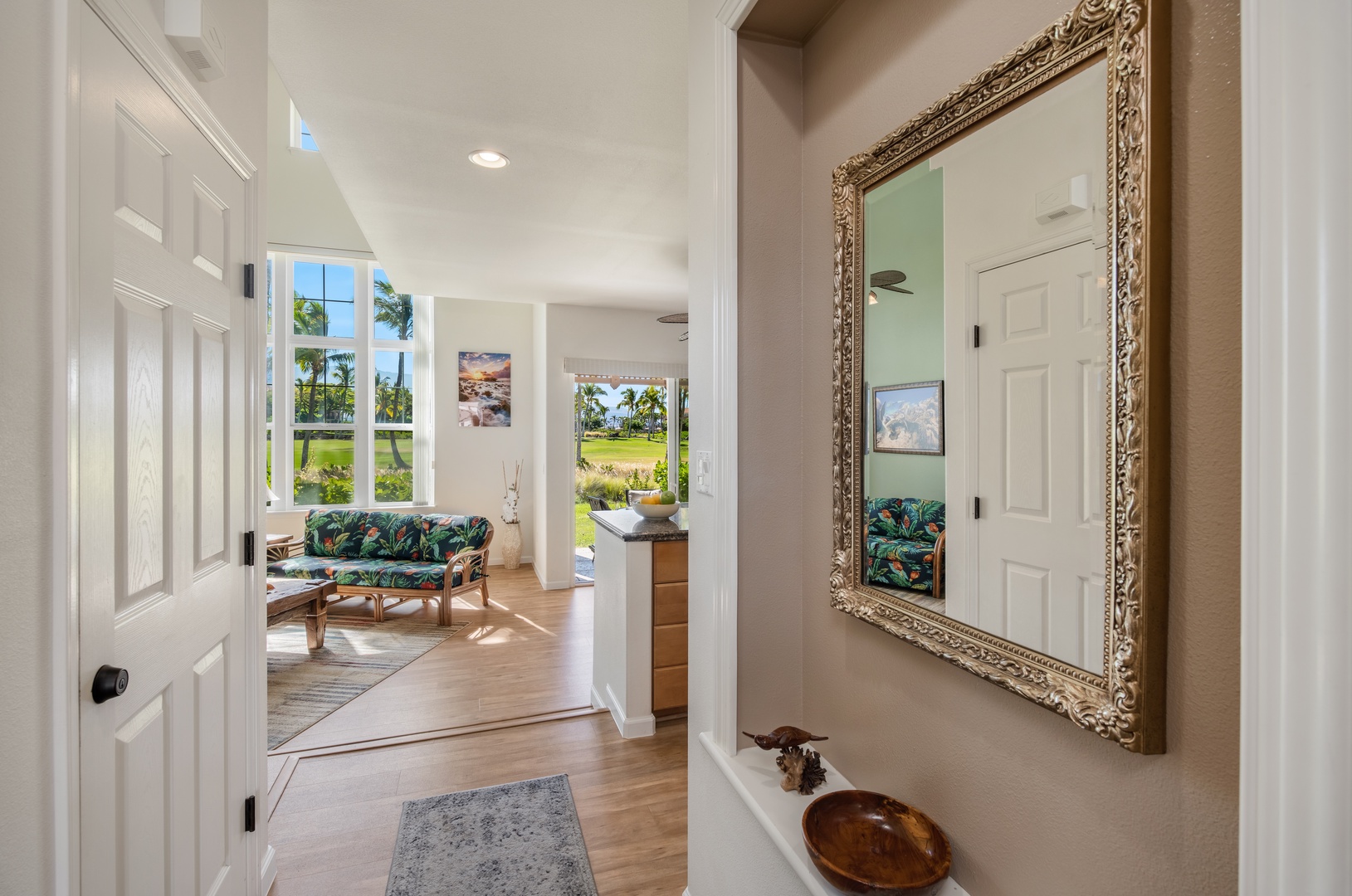 Waikoloa Vacation Rentals, Waikoloa Colony Villas 403 - Front door with charming decor leading into a cozy, inviting space.