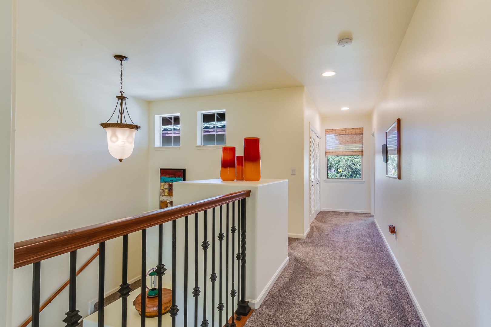 Kamuela Vacation Rentals, Mauna Lani Fairways #204 - The upper hallway connects two private suites, offering a quiet separation ideal for couples or shared getaways.