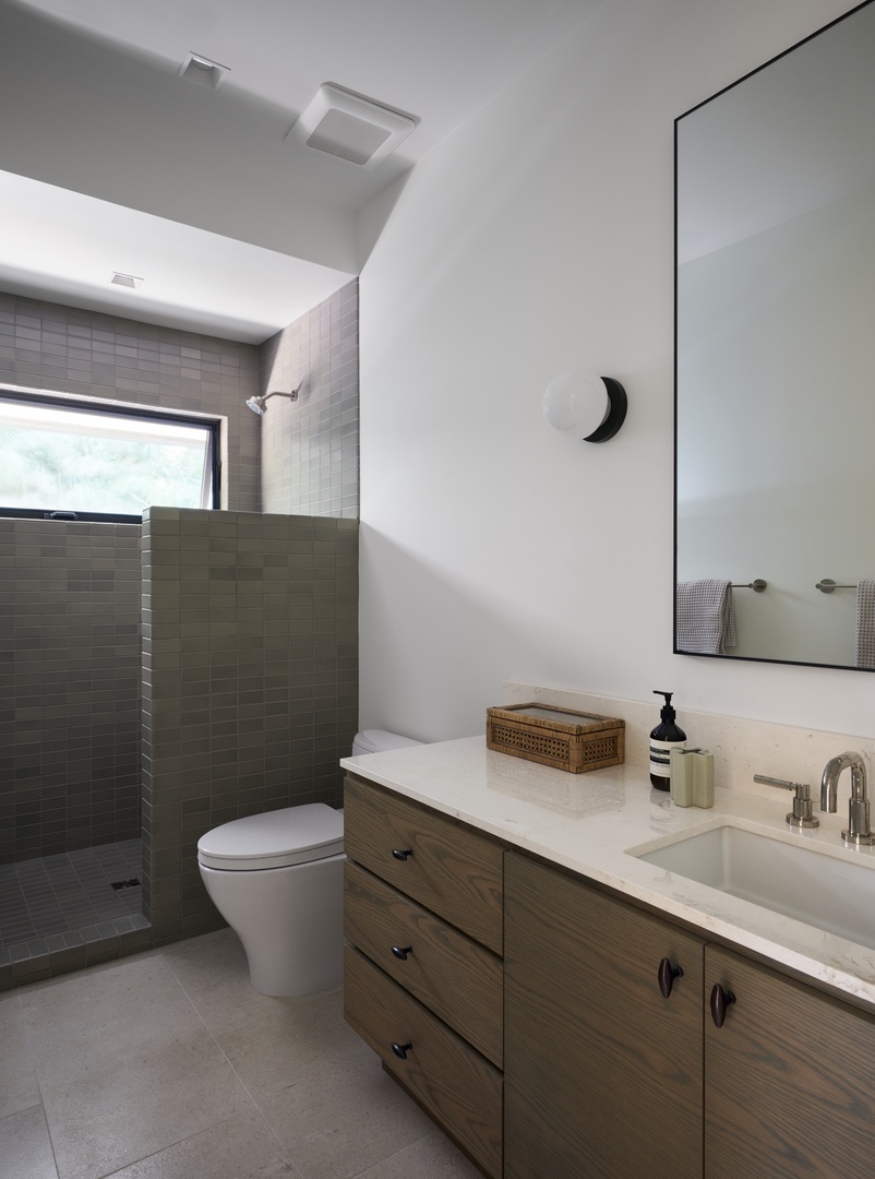 Honolulu Vacation Rentals, Diamond Head Hillside Estate** - Thoughtfully appointed with modern finishes and a walk-in shower, this serene bathroom offers both comfort and convenience.