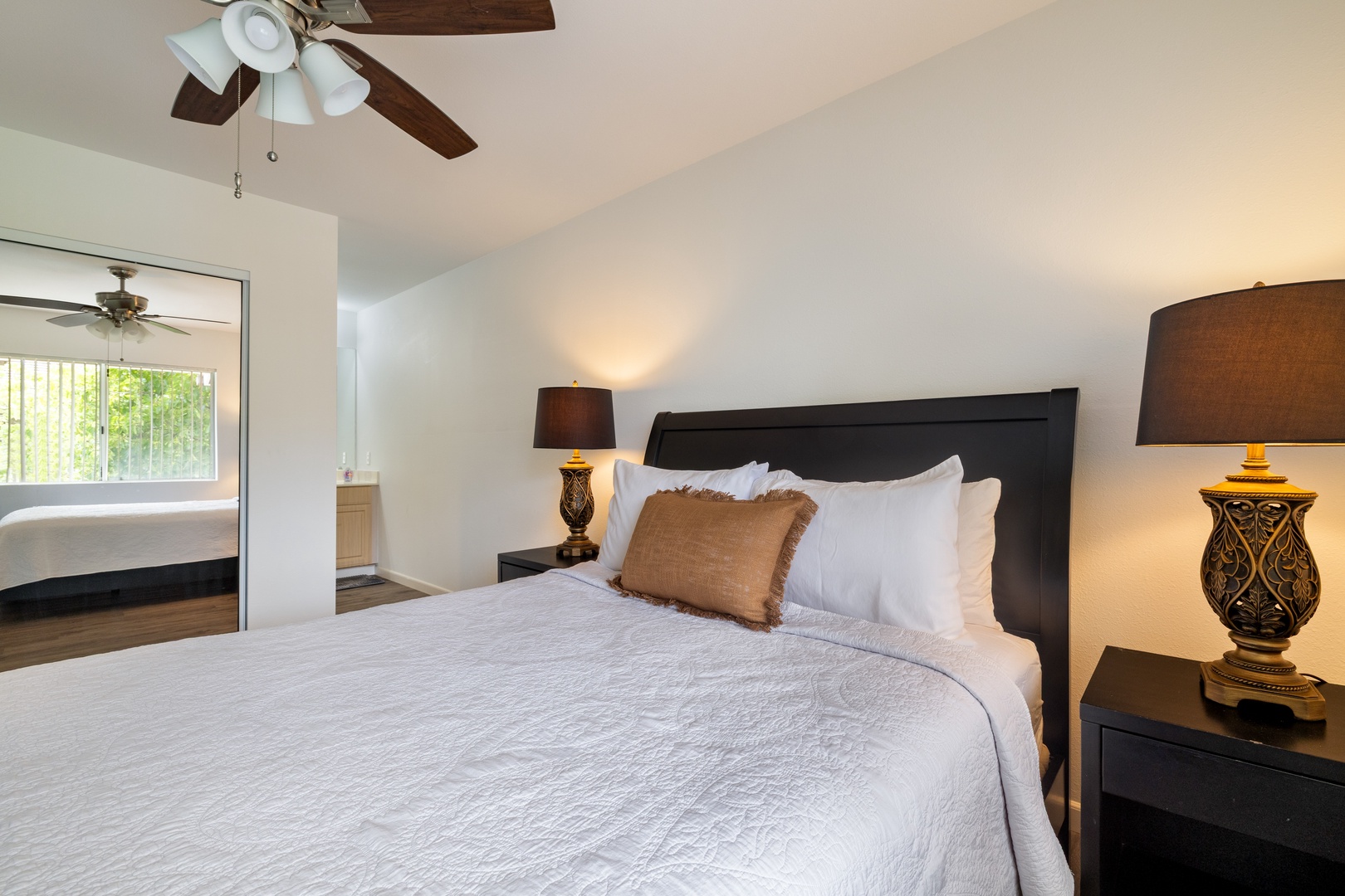 Kapolei Vacation Rentals, Fairways at Ko Olina 7A - Your peaceful bedroom features elegant dark furnishings, warm lighting, and crisp linens for restful nights.