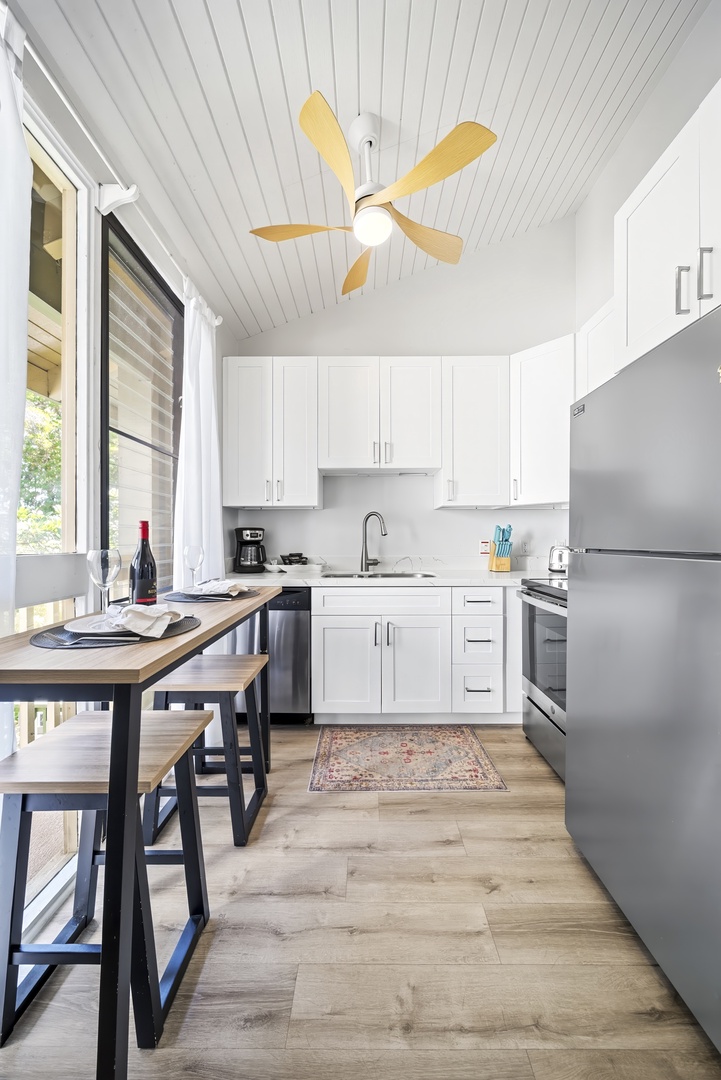 Kahuku Vacation Rentals, Kuilima Estates West #132 - Pull up to the counter for a quick bite, two stools waiting under the cabinets.