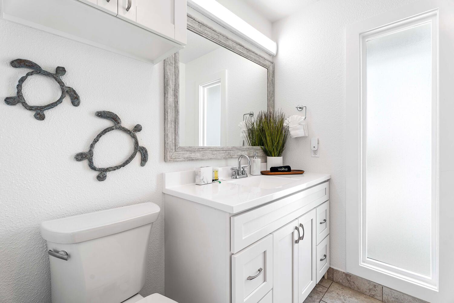 Kailua Kona Vacation Rentals, Hale Kai O'Kona #7 - The freshly remodeled guest bathroom with plenty of storage!