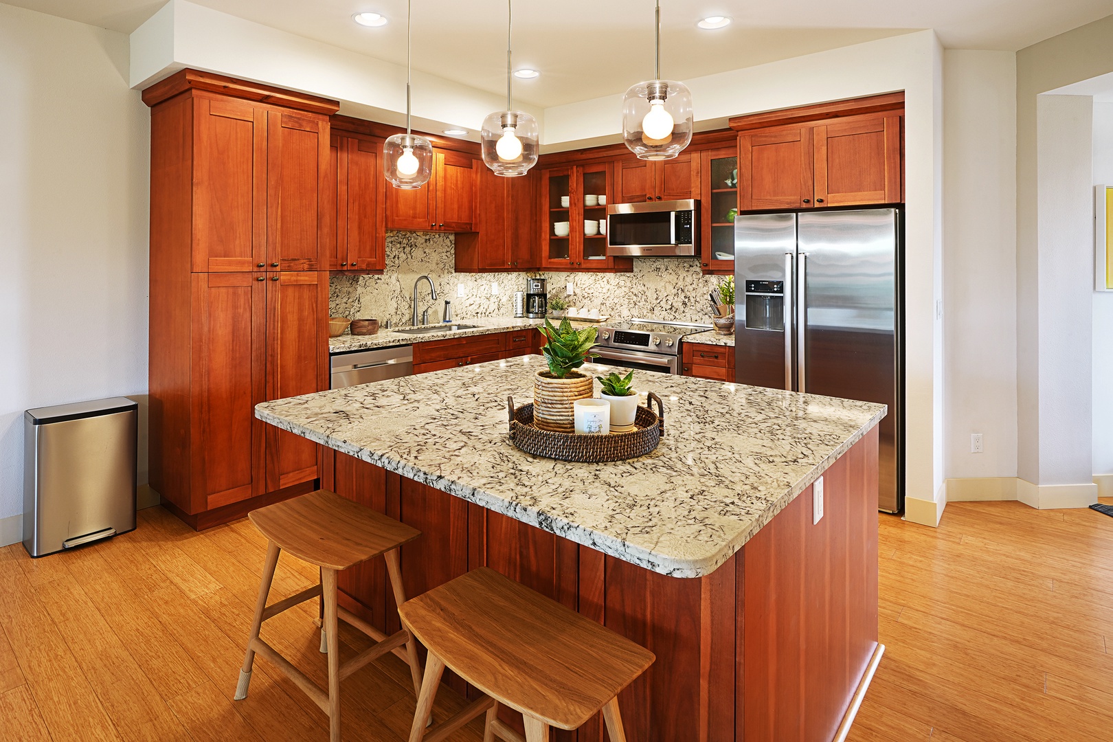 Koloa Vacation Rentals, Pili Mai 11K - The kitchen is fully equipped with stainless steel appliances and breakfast bar seating.
