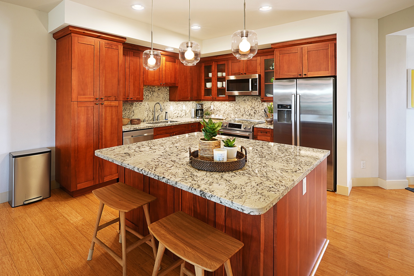 Koloa Vacation Rentals, Pili Mai 11K - The kitchen is fully equipped with stainless steel appliances and breakfast bar seating.