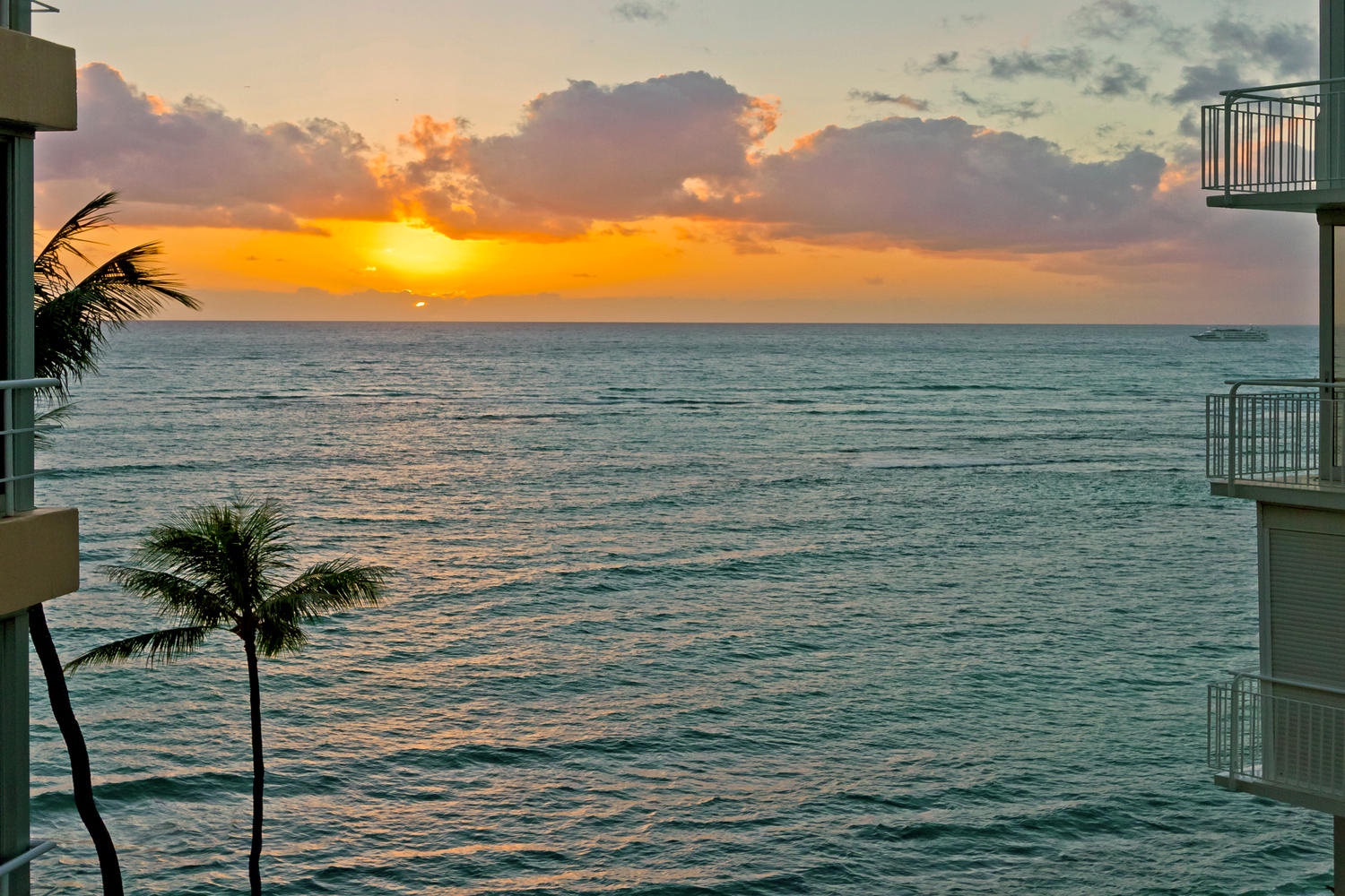 Honolulu Vacation Rentals, Executive Gold Coast Oceanfront Suite - Exceptional sunsets from the living room.