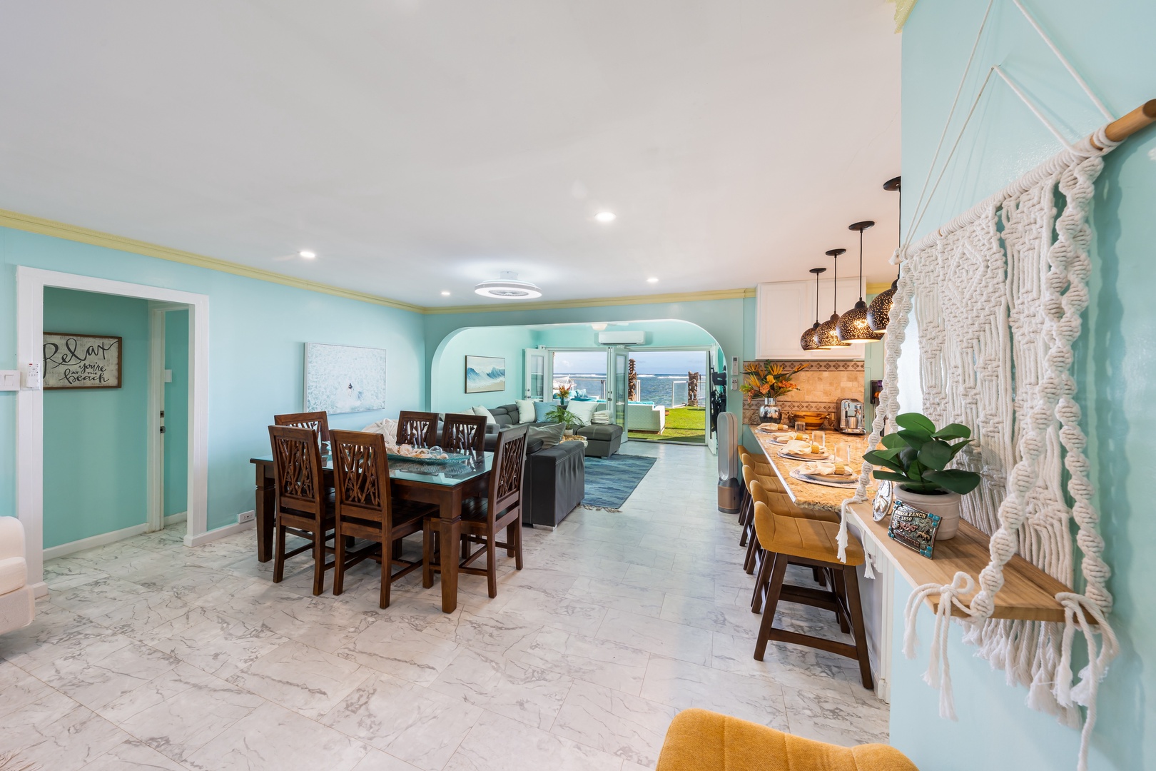 Hauula Vacation Rentals, Private Beach Paradise - Spacious dining area that flows seamlessly into the kitchen and living space.