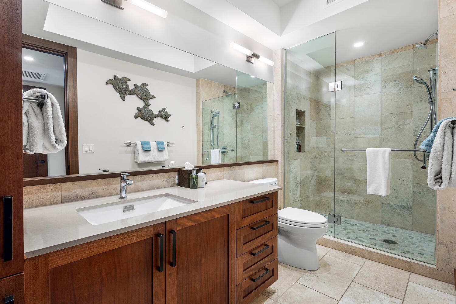 Kamuela Vacation Rentals, Laule'a Ohana Retreat - Bright and modern guest bathroom with walk-in shower and rich wood accents at Laule'a #13.
