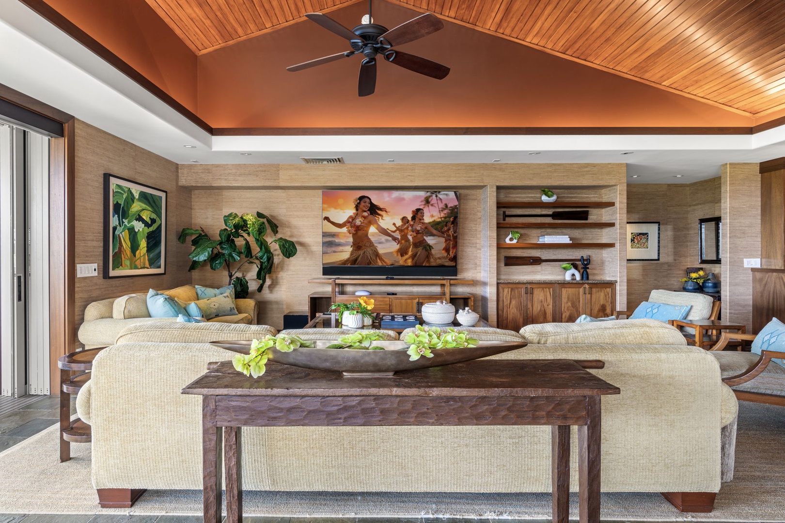 Kailua Kona Vacation Rentals, 3BD Pakui Street Estate (149) at Hualalai Resort - Kick back on the sofas, framed island art on one wall, koa shelving on the next.