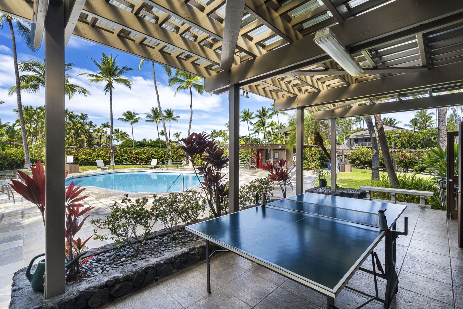 Kailua Kona Vacation Rentals, Kanaloa at Kona 1606 - Ping pong under the pavilion, the pool waiting just past the paddles.