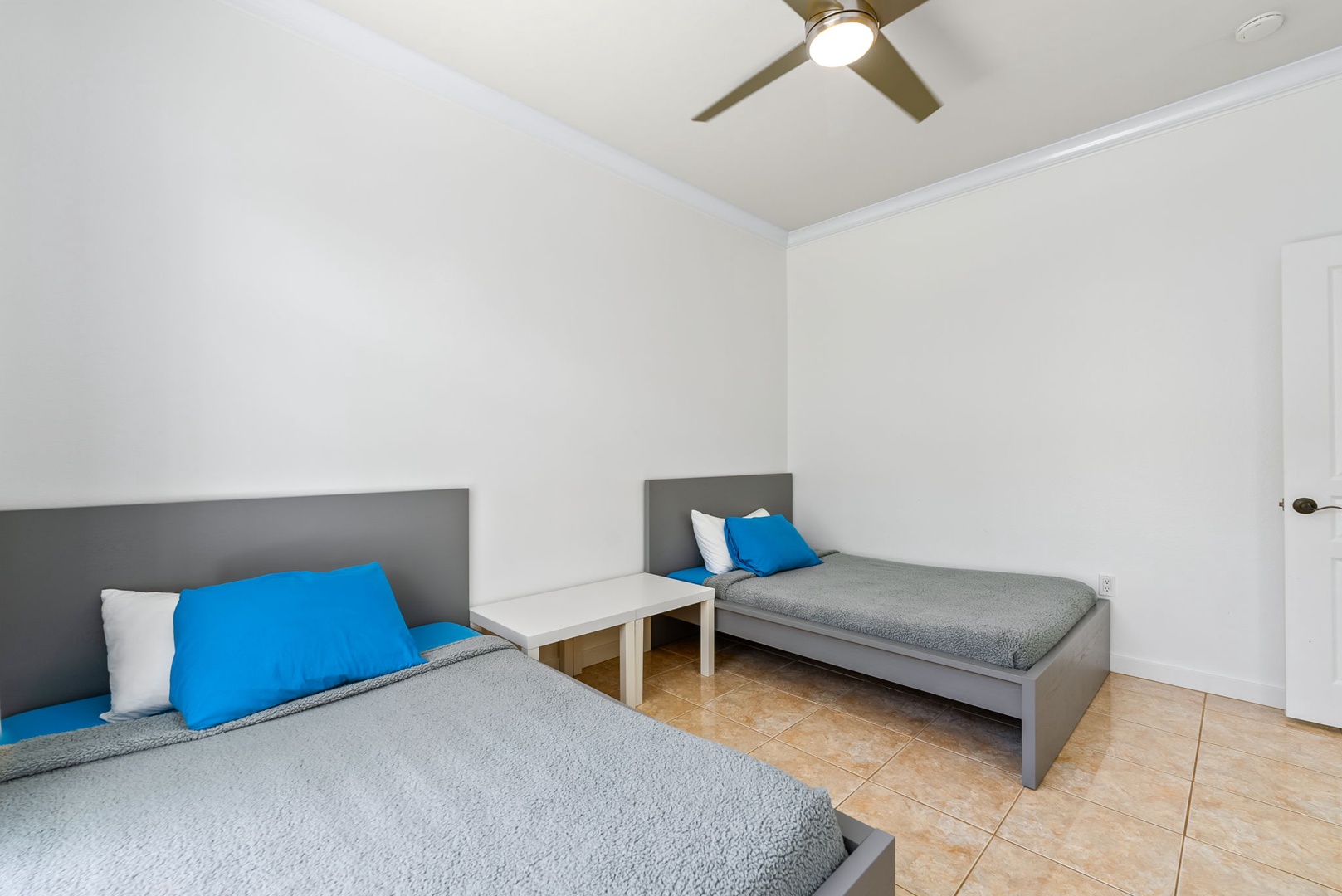 Kapolei Vacation Rentals, Kai Lani Luxury 6D - Bedroom with two twin beds, perfect for families or friends, complete with comfortable bedding and a ceiling fan.