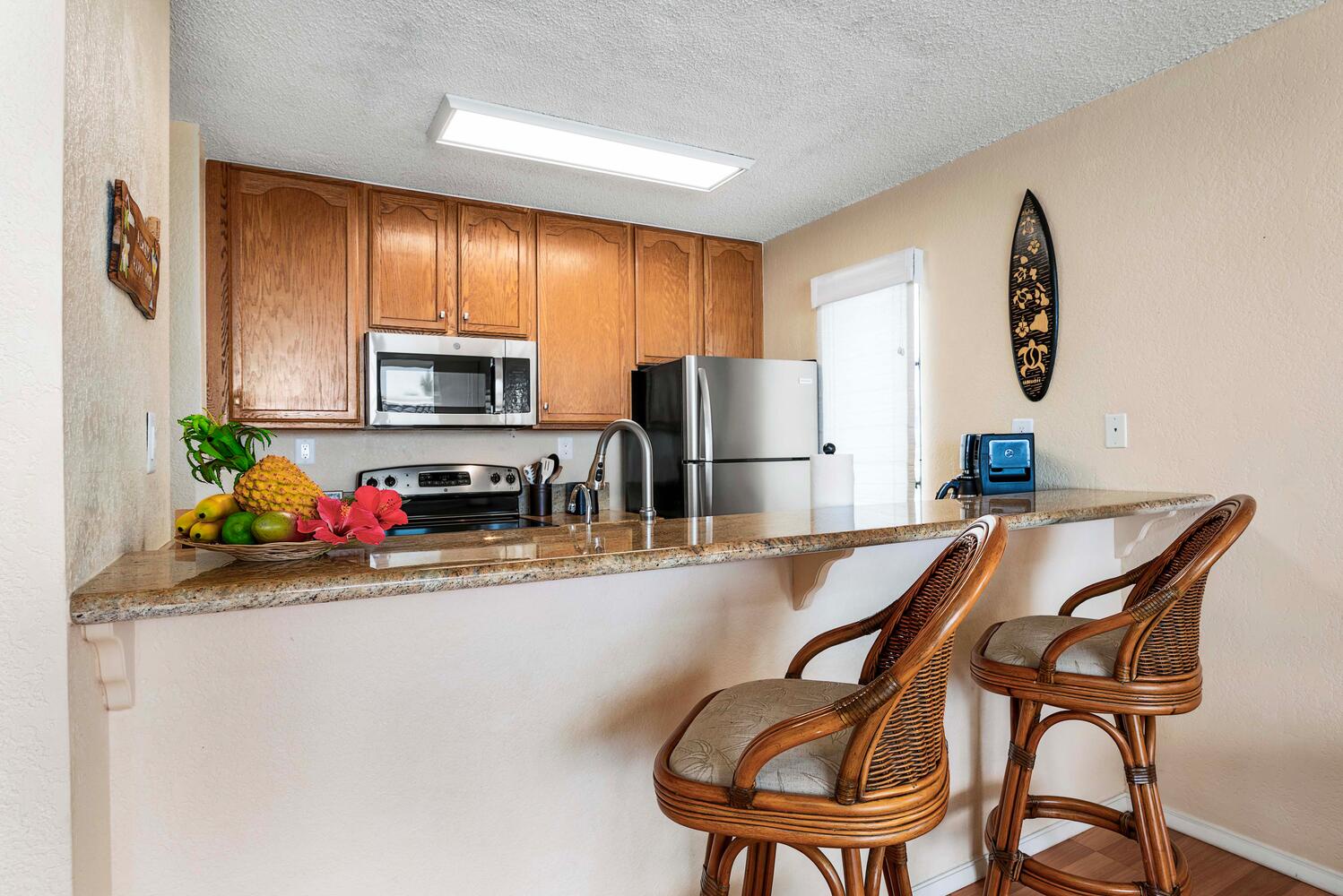 Kailua Kona Vacation Rentals, Kona Reef F11 - Kitchen has breakfast bar seating.