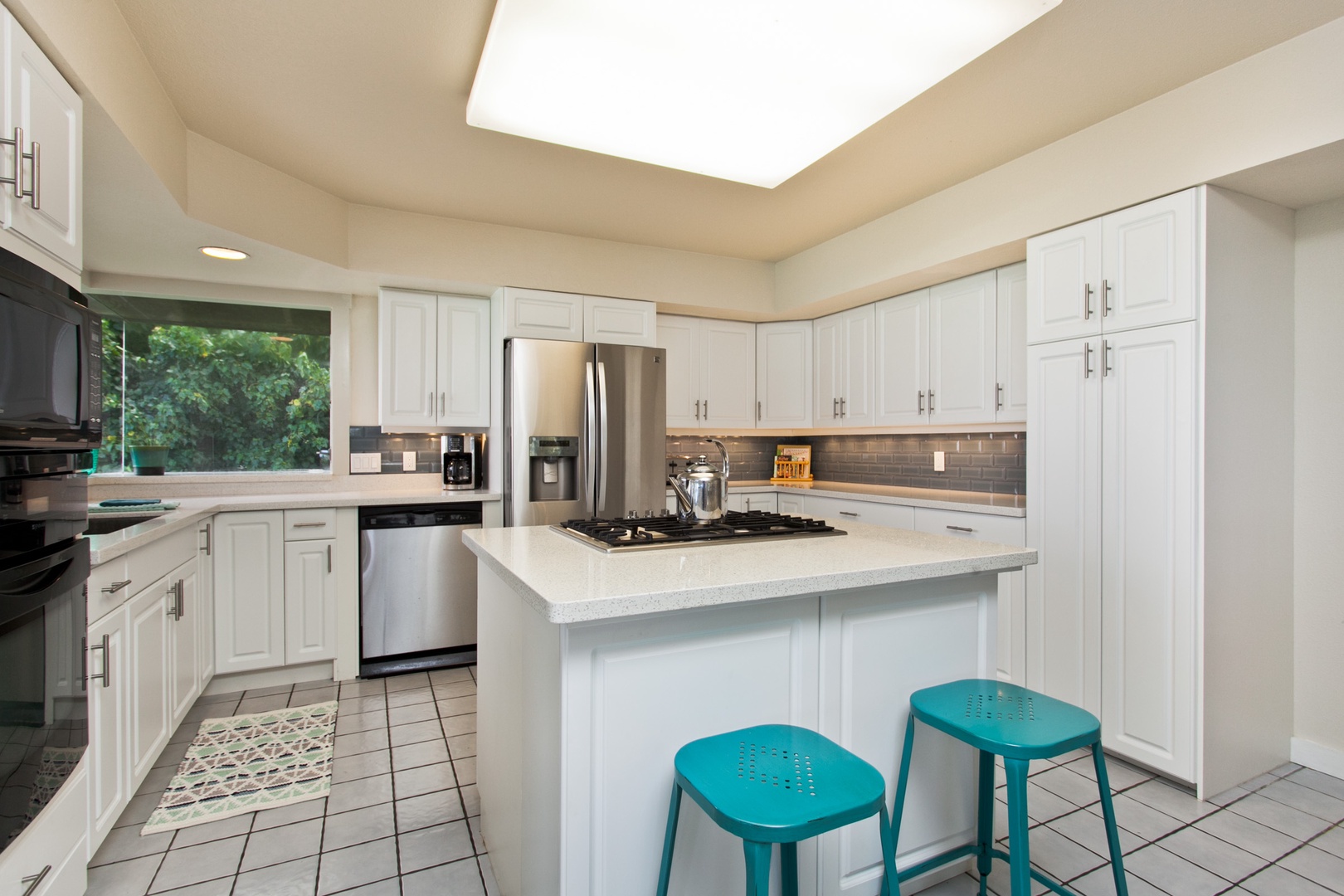 Kailua Vacation Rentals, Lanikai Village* - Hale Kolea: Kitchen area with stainless steel appliances and plenty of cabinets for storing your kitchen needs.