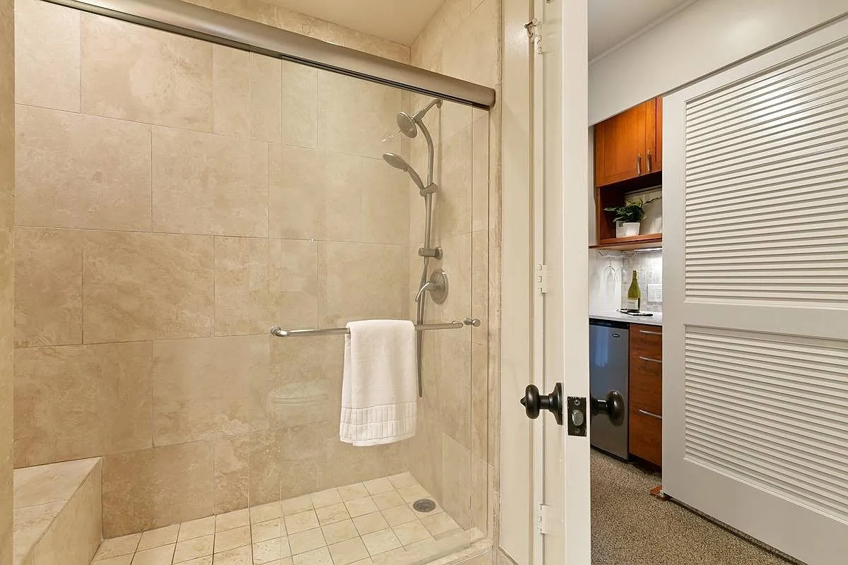Princeville Vacation Rentals, Hanalei Bay Resort 4301/2/3 - Luxurious walk-in shower with modern fixtures and neutral-toned tile design. – Perfect for refreshing after a day of exploration.