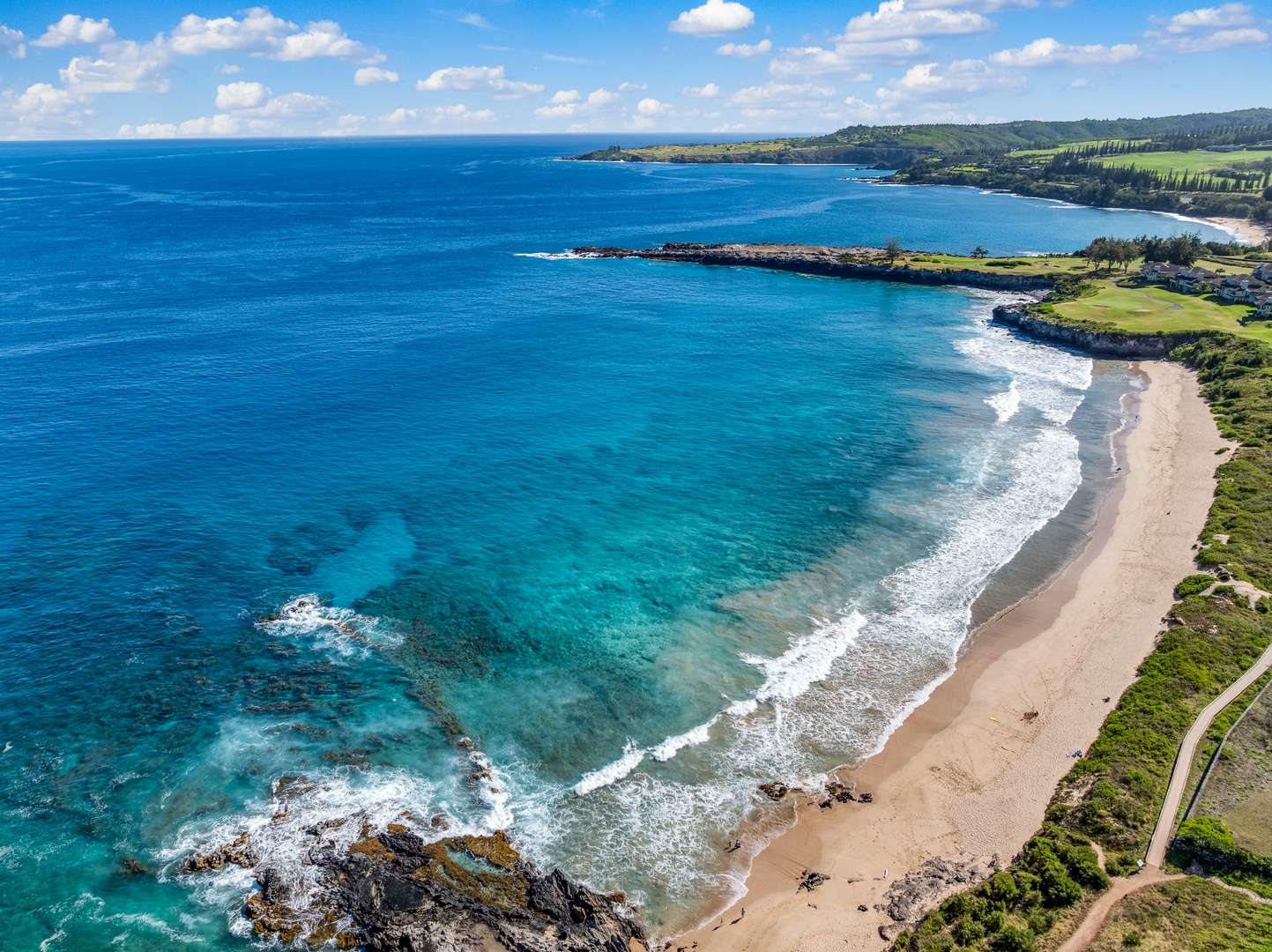 Lahaina Vacation Rentals, Kapalua Ridge 1421 - Kapalua Ridge Villas Resort offers stunning coastal views where vibrant blue waters meet rugged shorelines and greenery.