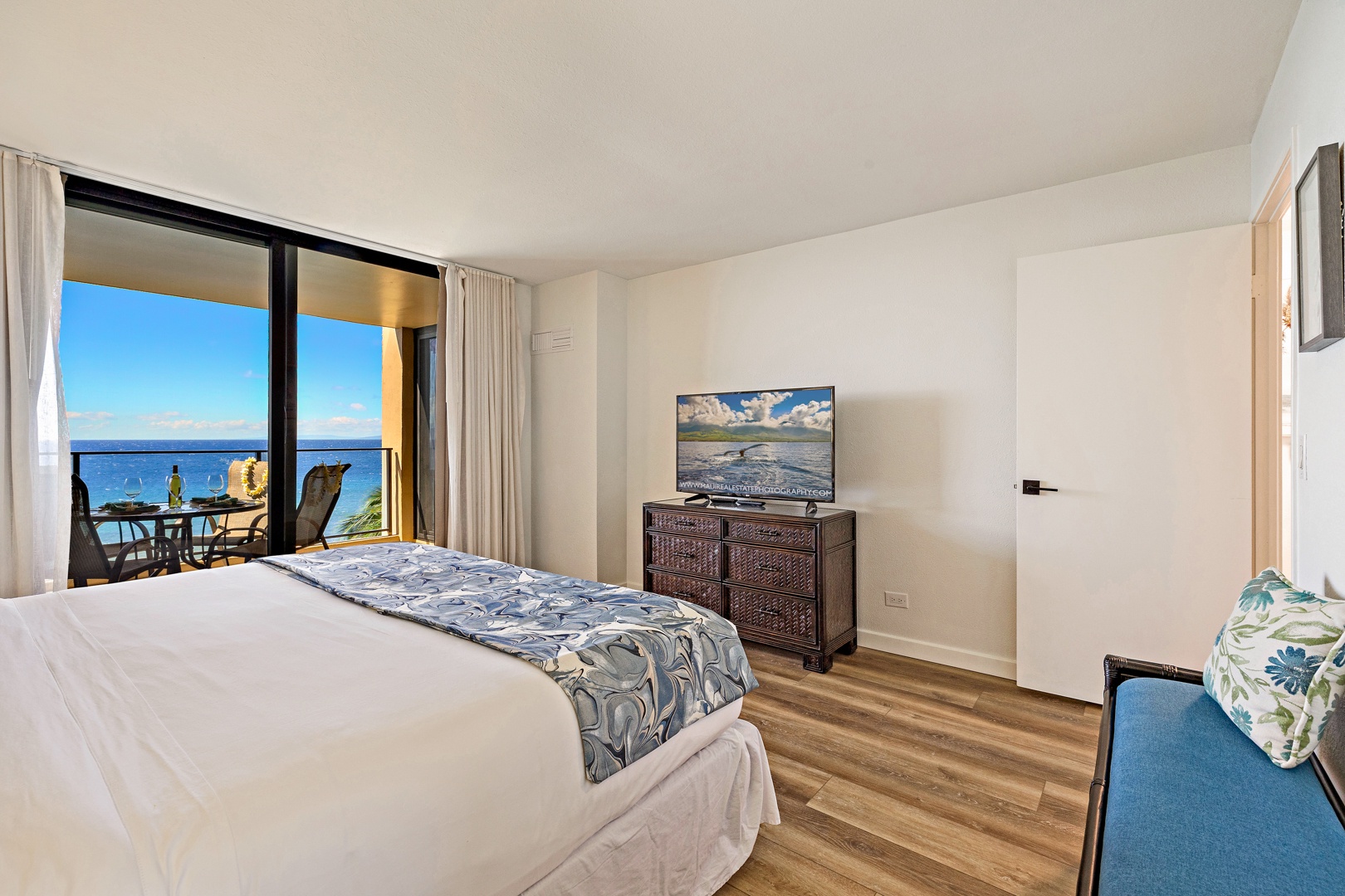 Lahaina Vacation Rentals, Mahana 718 - The bedroom at Mahana 718 features a flat-screen TV and seamless lanai access.