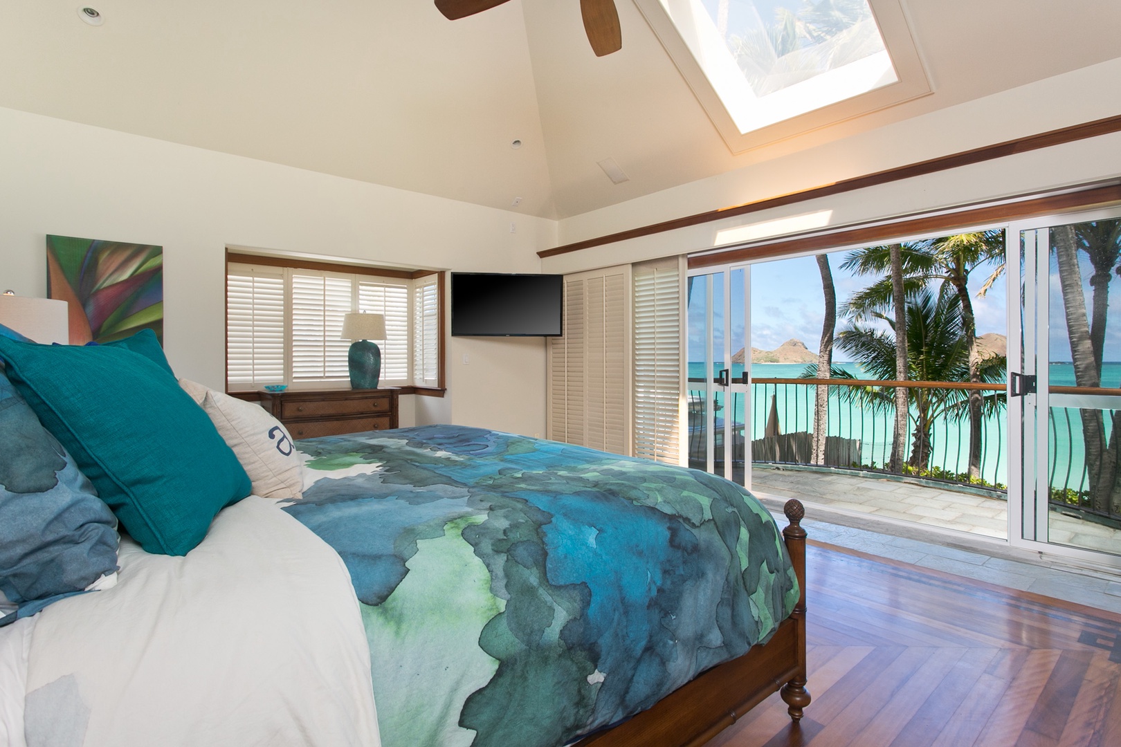 Kailua Vacation Rentals, Lanikai Village* - Hale Melia: Primary suite with a plush king bed, TV, ensuite bathroom with a large tub and a private lanai.