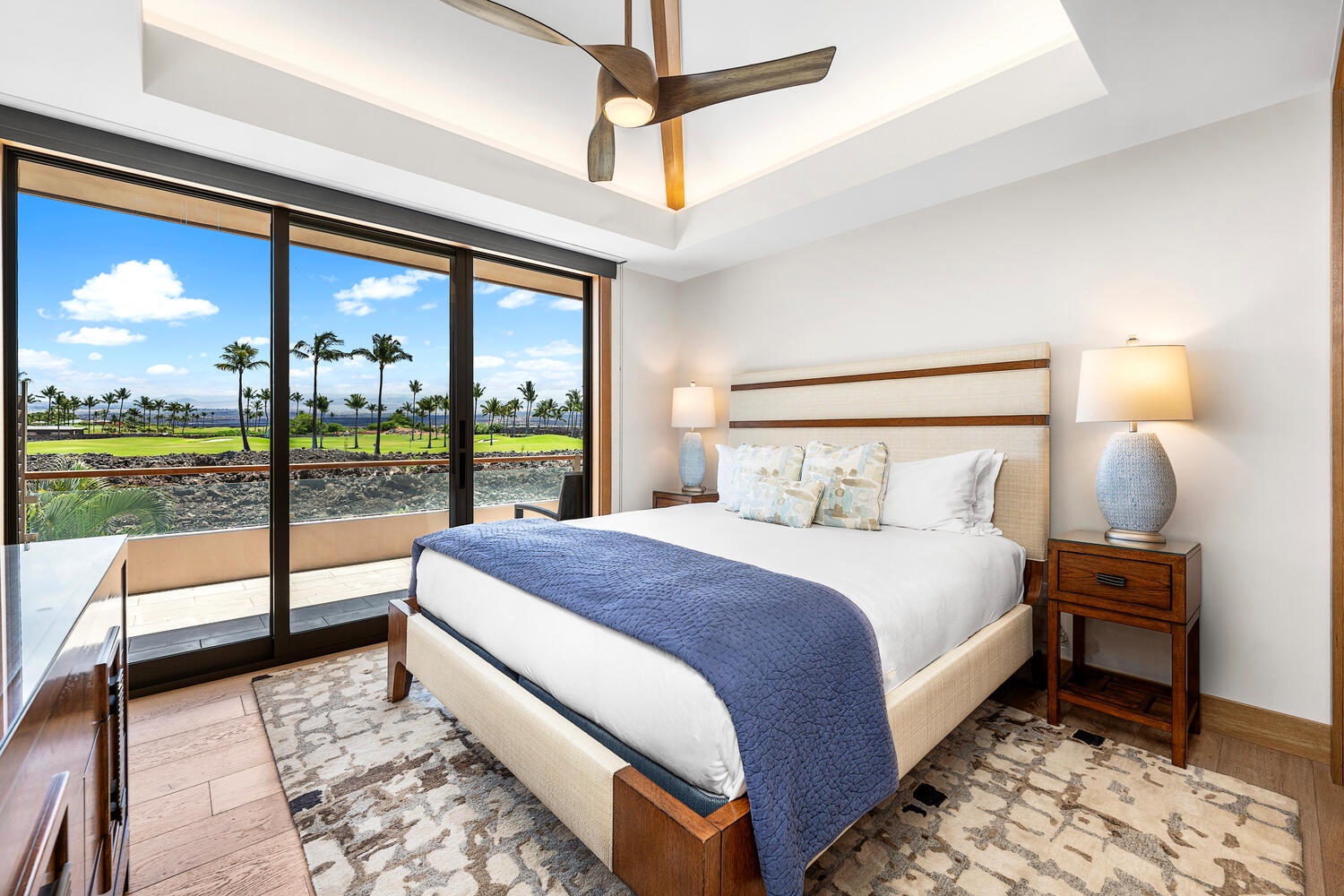Kamuela Vacation Rentals, Laule'a at the Mauna Lani Resort #14 - Guest bedroom with king bed and private lanai overlooking the fairway.