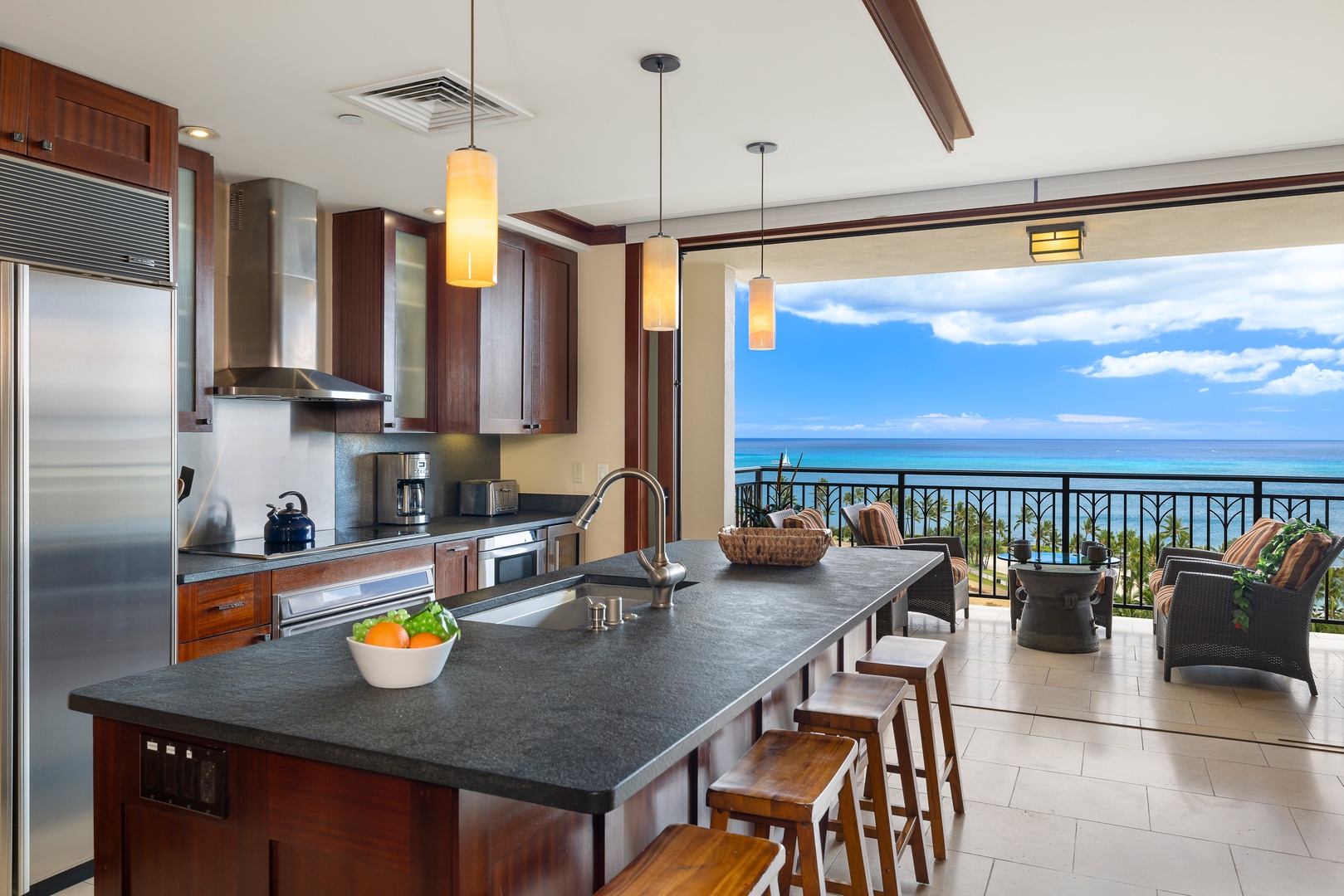 Kapolei Vacation Rentals, Ko Olina Beach Villas O1105 - The view from the kitchen looking to the lanai and beyond.