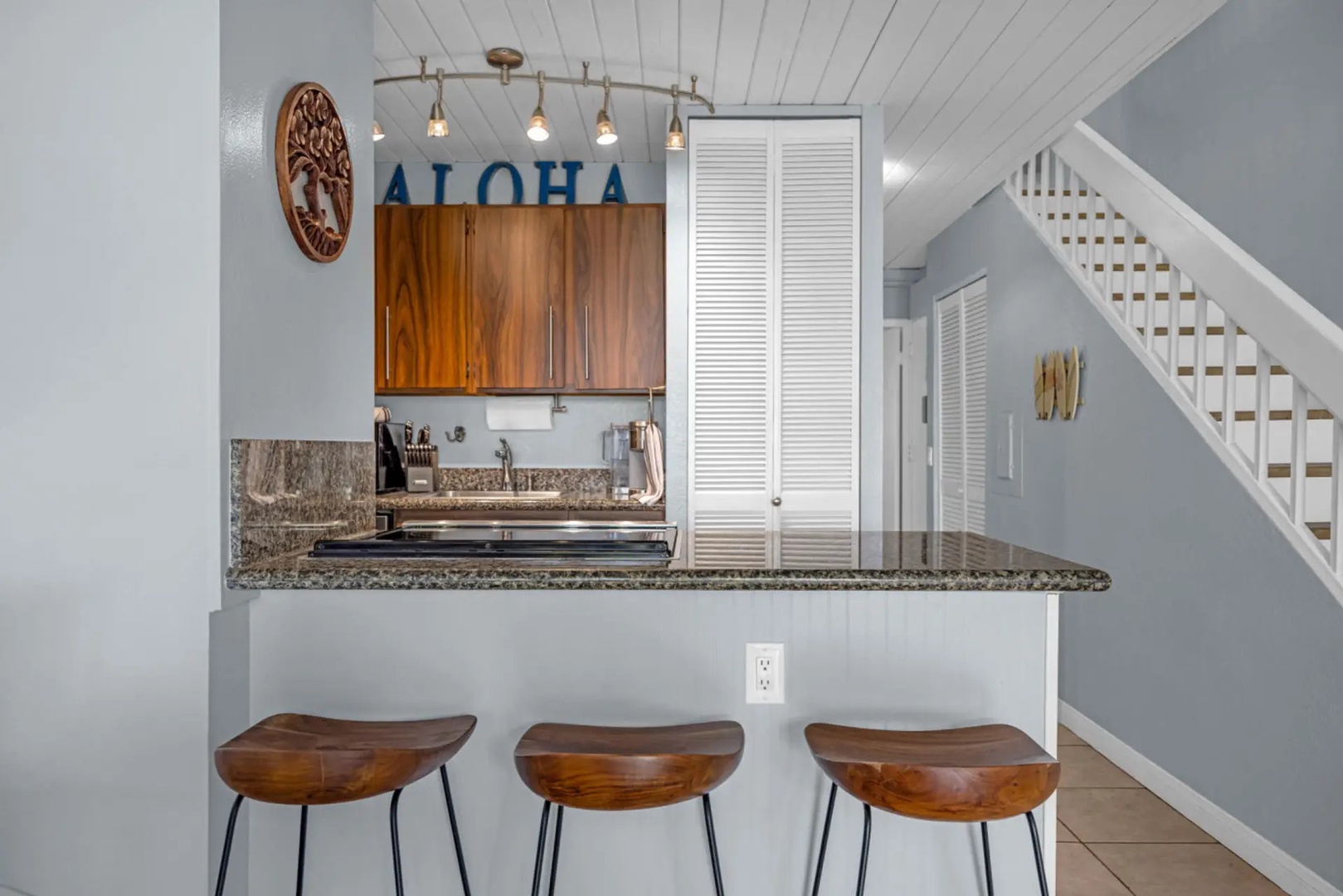 Kihei Vacation Rentals, Maui Vista 2420 - A trio of wood stools at the counter, pulled up for a quick bite or a long talk.
