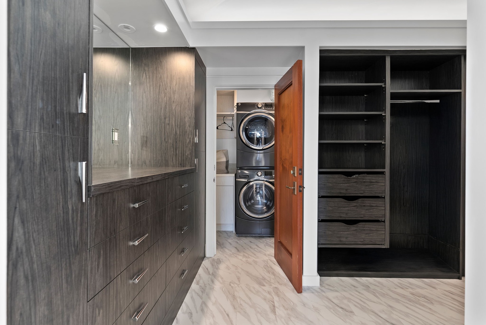 Honolulu Vacation Rentals, Honolulu Lagoonfront Villa - Dedicated laundry room with full-size washer/dryer, storage cabinets, and exterior access for easy beach transitions.