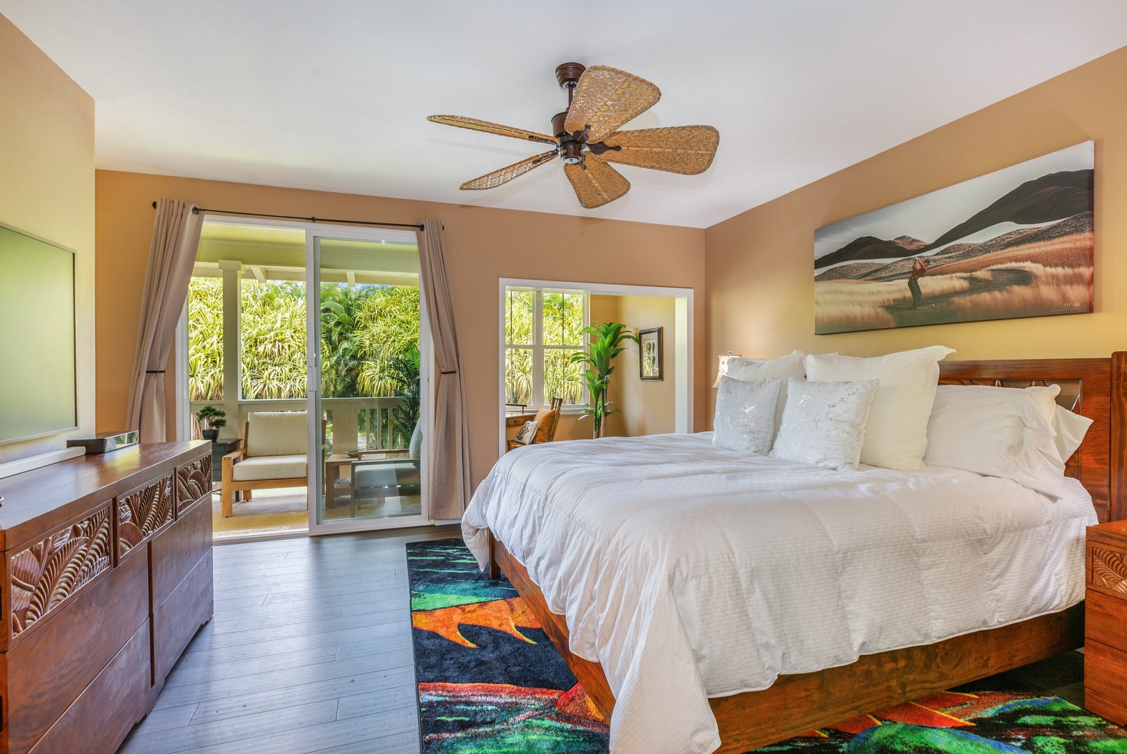 Princeville Vacation Rentals, Pualani Villa - The primary bedroom features a king-size bed, private lanai access, and plenty of natural light.