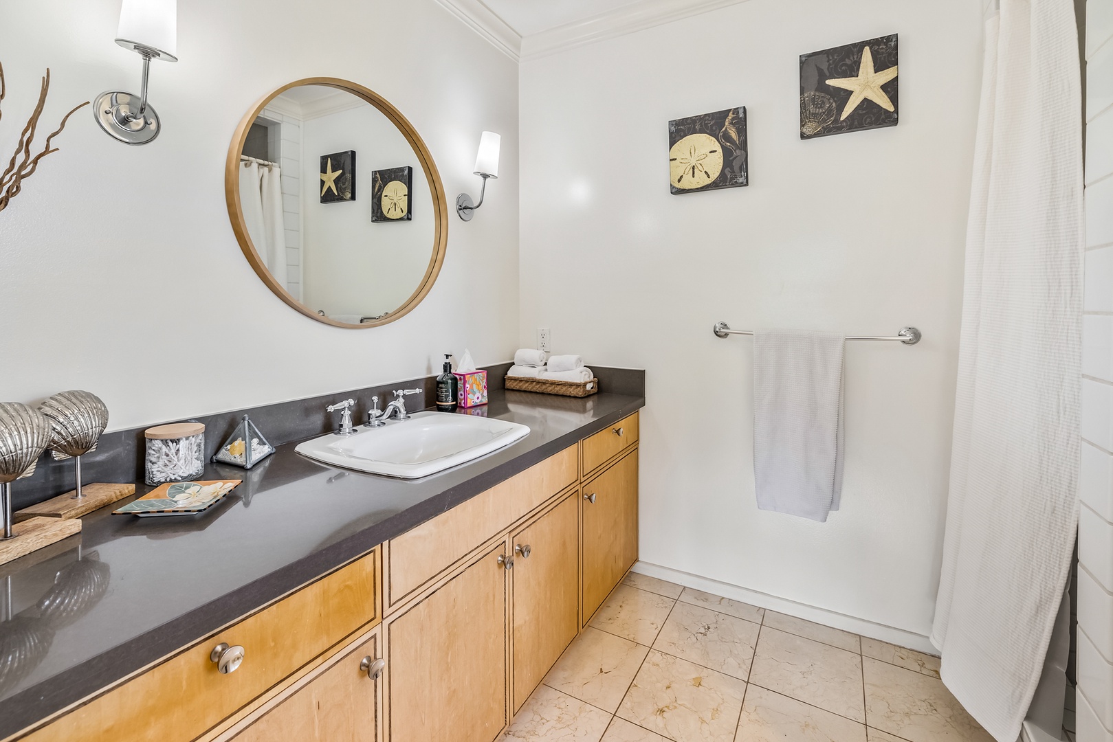Honolulu Vacation Rentals, Moana Lani - Main House - Shake off the sand and get ready at a long wood vanity with room to spread out.