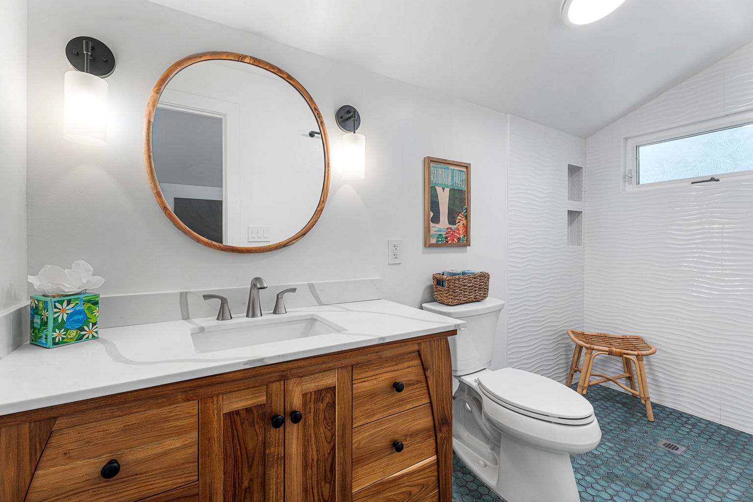 Kailua Kona Vacation Rentals, Manukai Hale - A round mirror over a wood vanity finishes this bath with an easy island touch.