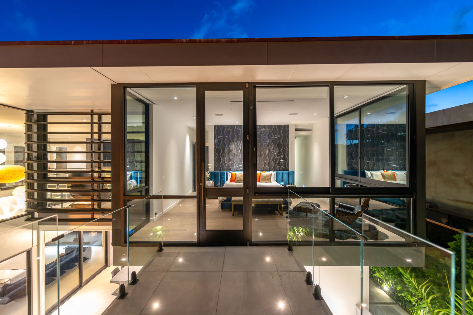 Honolulu Vacation Rentals, Ocean Villa Emilie - Glass-paneled bridges and custom lighting create an unforgettable sense of arrival for every guest.