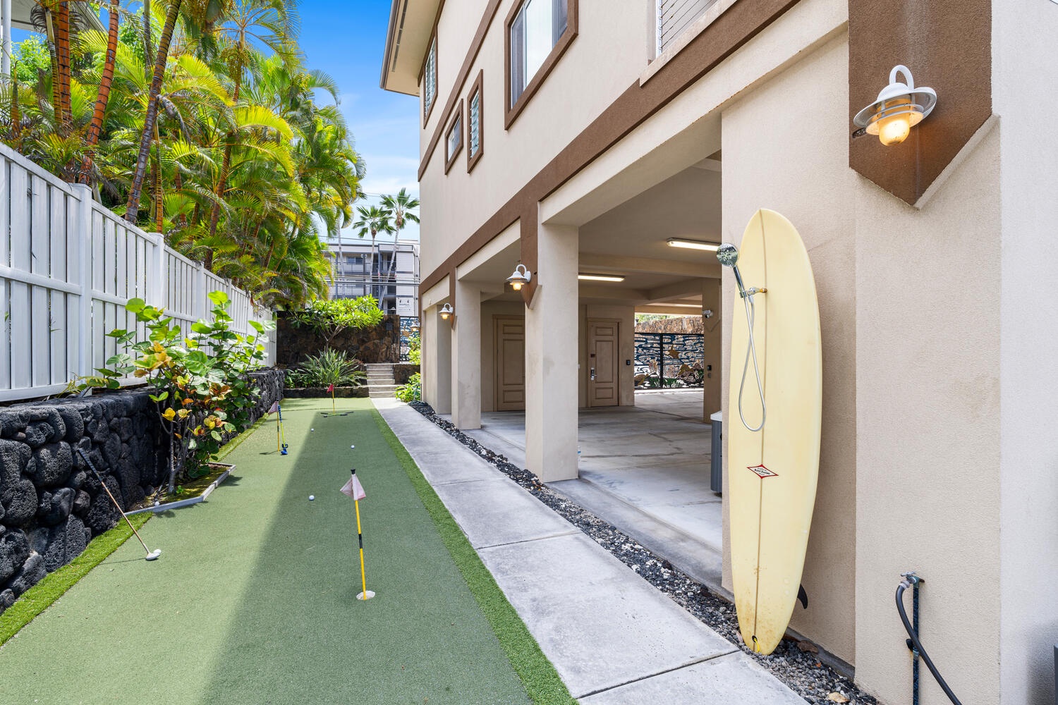 Kailua Kona Vacation Rentals, Kailani Vista - Tune up your short game beside custom surfboard outdoor shower and the shaded carport—perfect prep before tee time at nearby Kona Country Club.