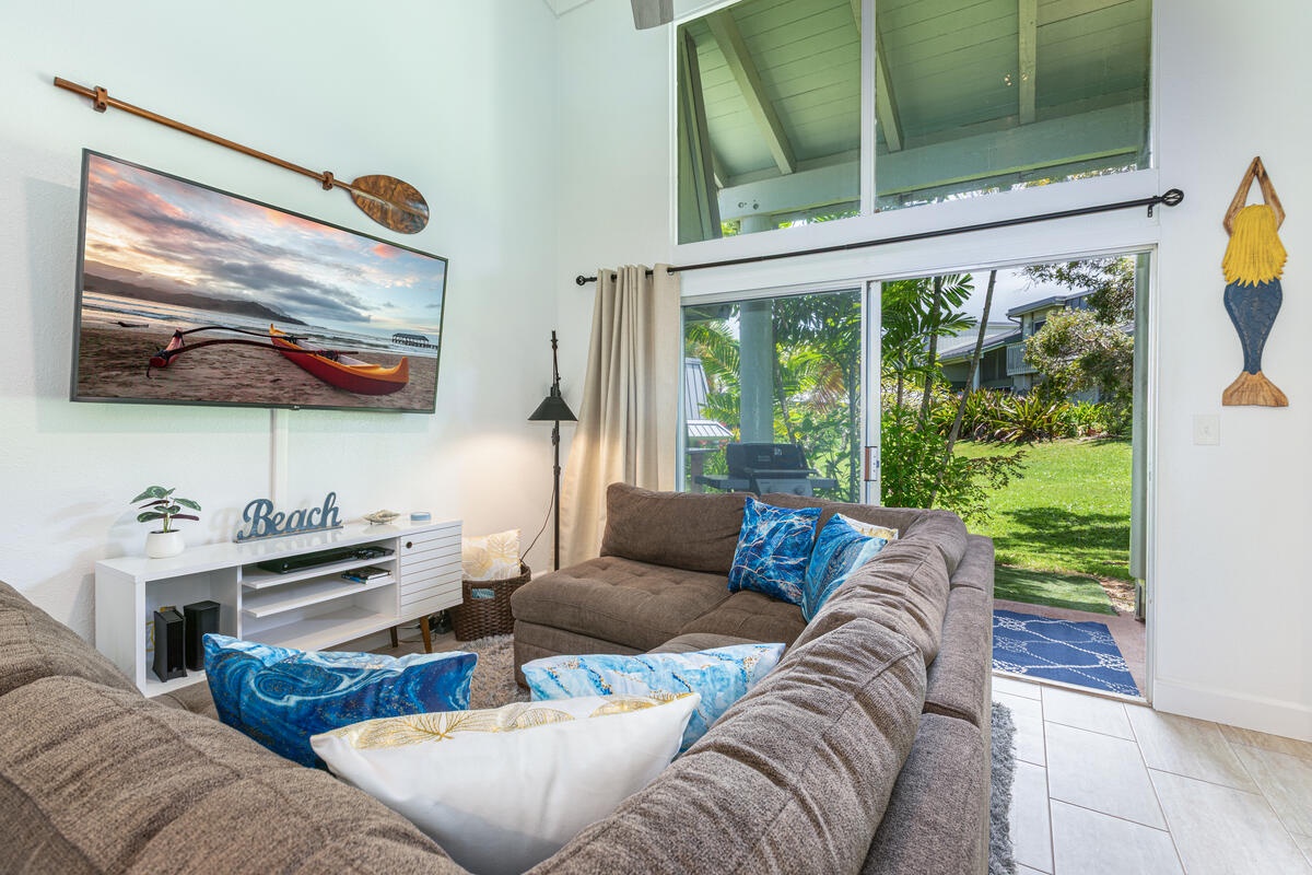Princeville Vacation Rentals, Hale Hana Mana’o - Cozy great room with vaulted ceilings and lush garden views.