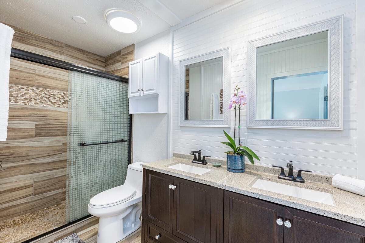 Princeville Vacation Rentals, Hale Hana Mana’o - Freshen up in this bright, modern bathroom with ample counter space and natural finishes.