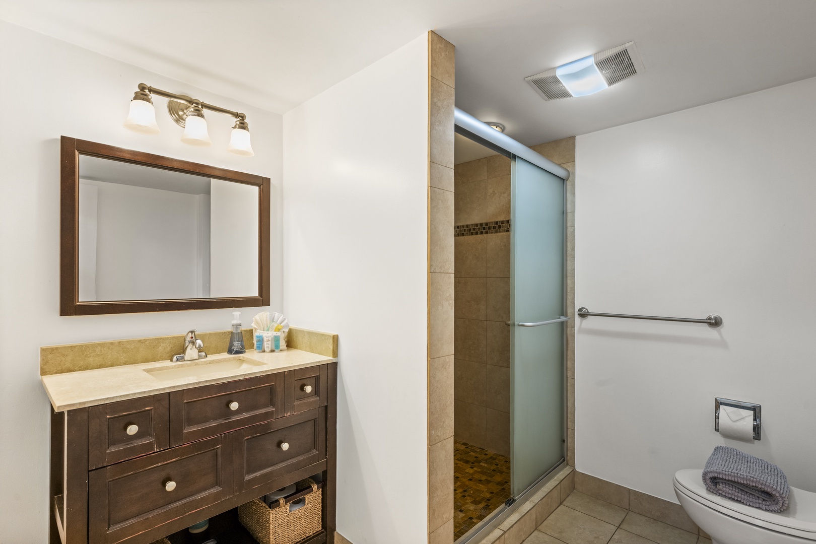 Kihei Vacation Rentals, Koa Resort 1B - Rinse off the beach in the walk-in shower, then get ready for dinner at the vanity.