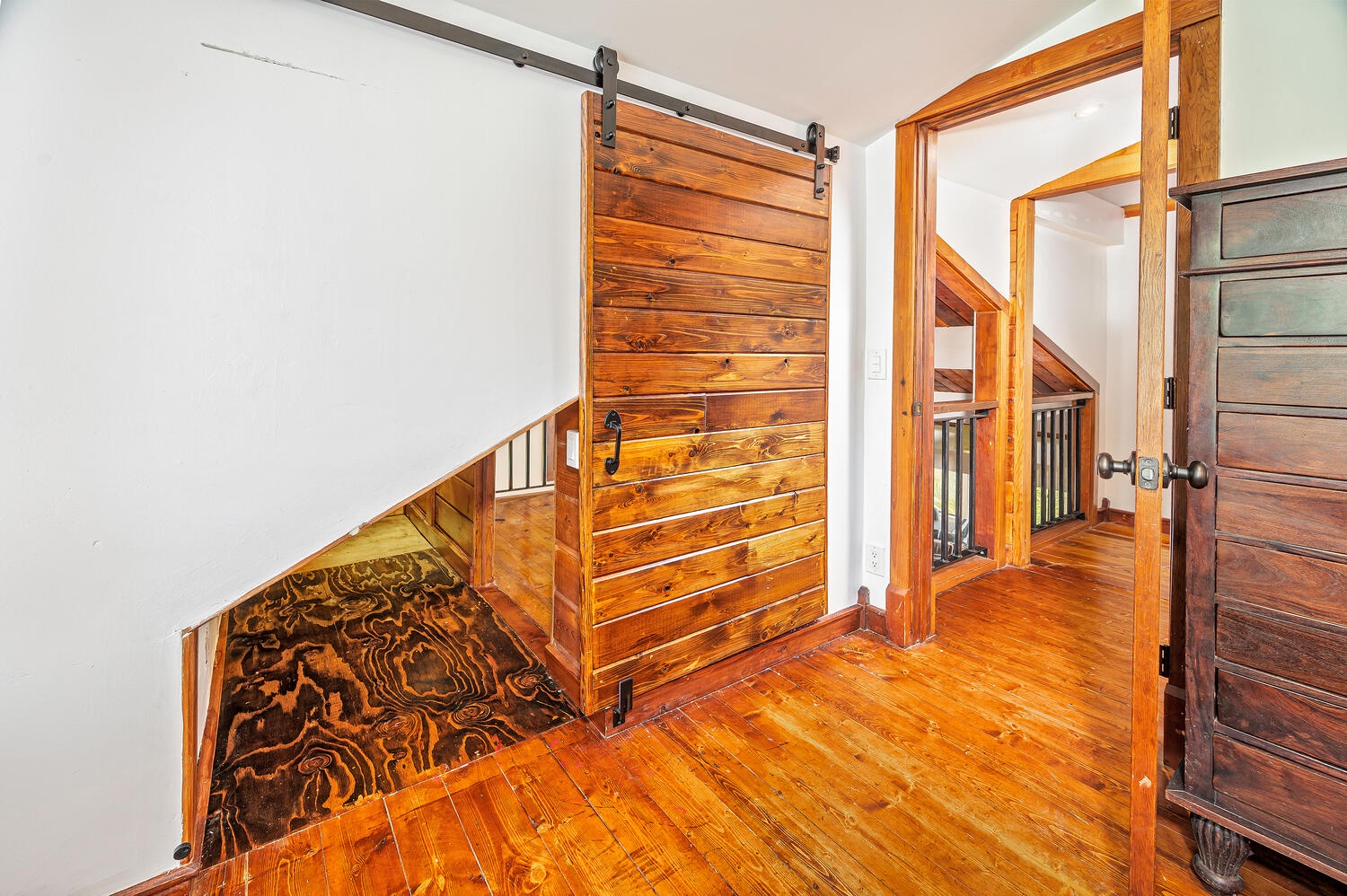 Haleiwa Vacation Rentals, Mele Makana - In bedroom 7, the entrance to the interior balcony can be closed with the wooden sliding door