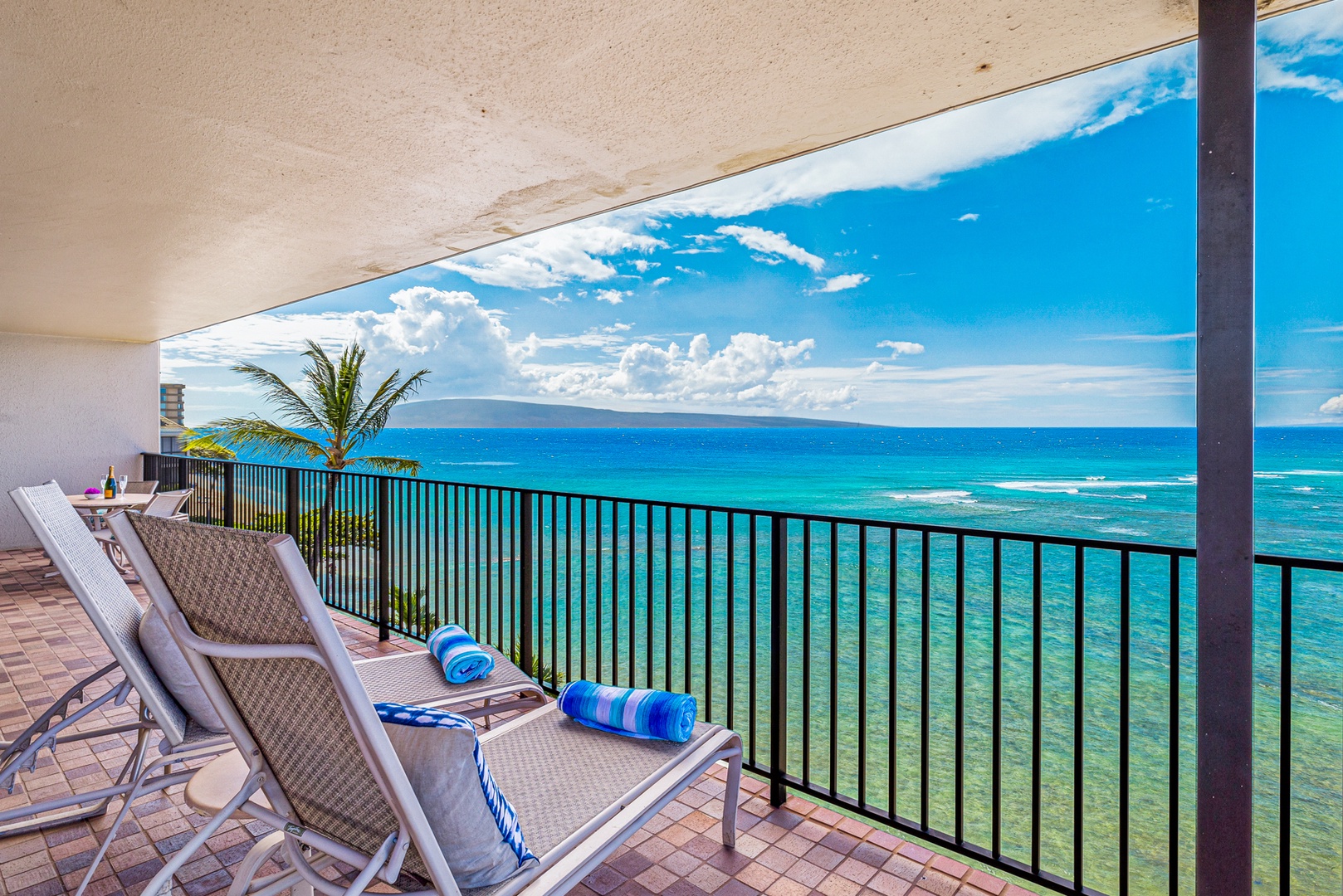 Lahaina Vacation Rentals, Kaanapali Shores 502 - Enjoy a sun-soaked afternoon or a peaceful moment on the private lanai, complete with comfortable lounge chairs.