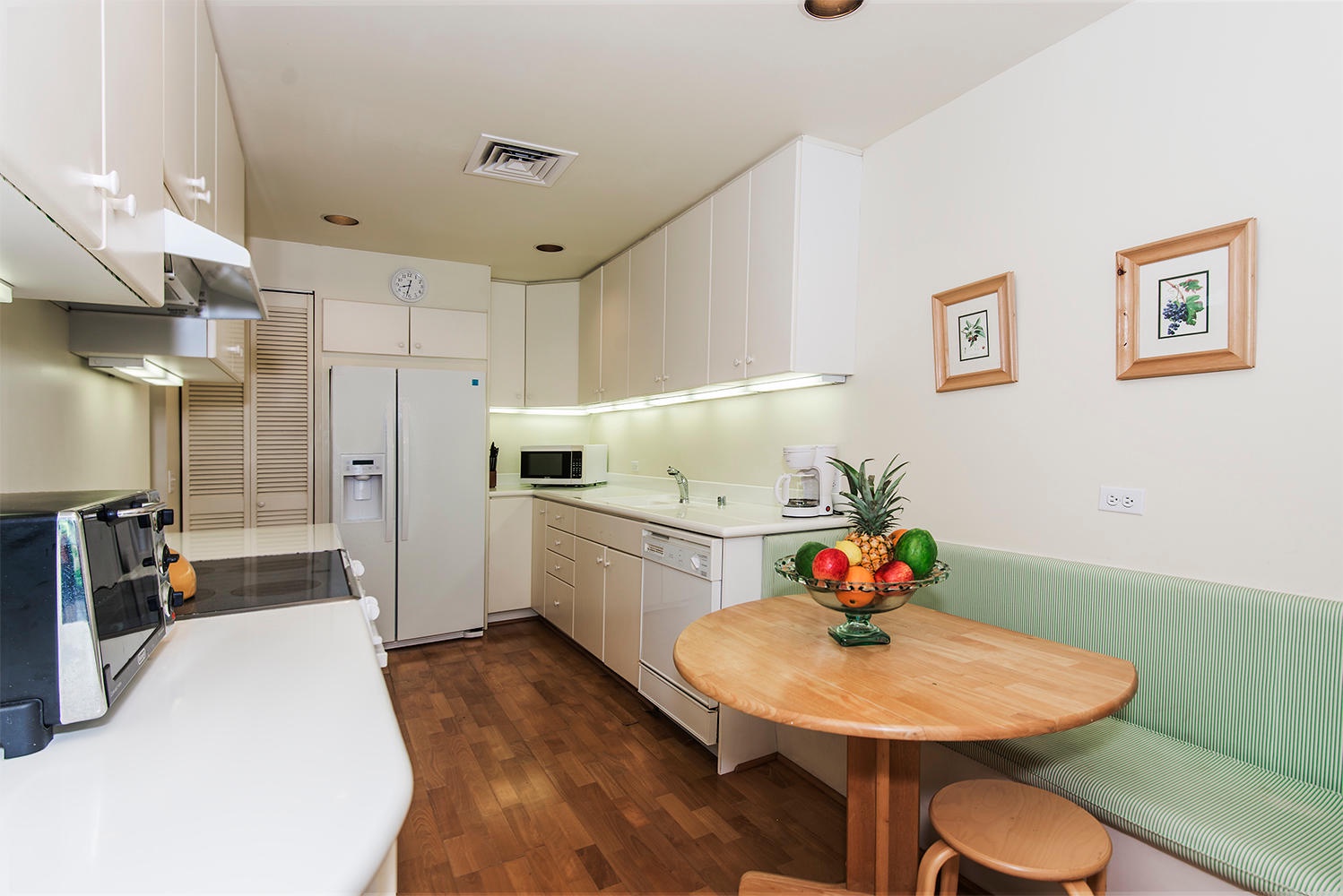 Honolulu Vacation Rentals, Kahala Beachfront Villa - The kitchen offers top tier appliances to make meal prepping a breeze and a breakfast nook on the side.