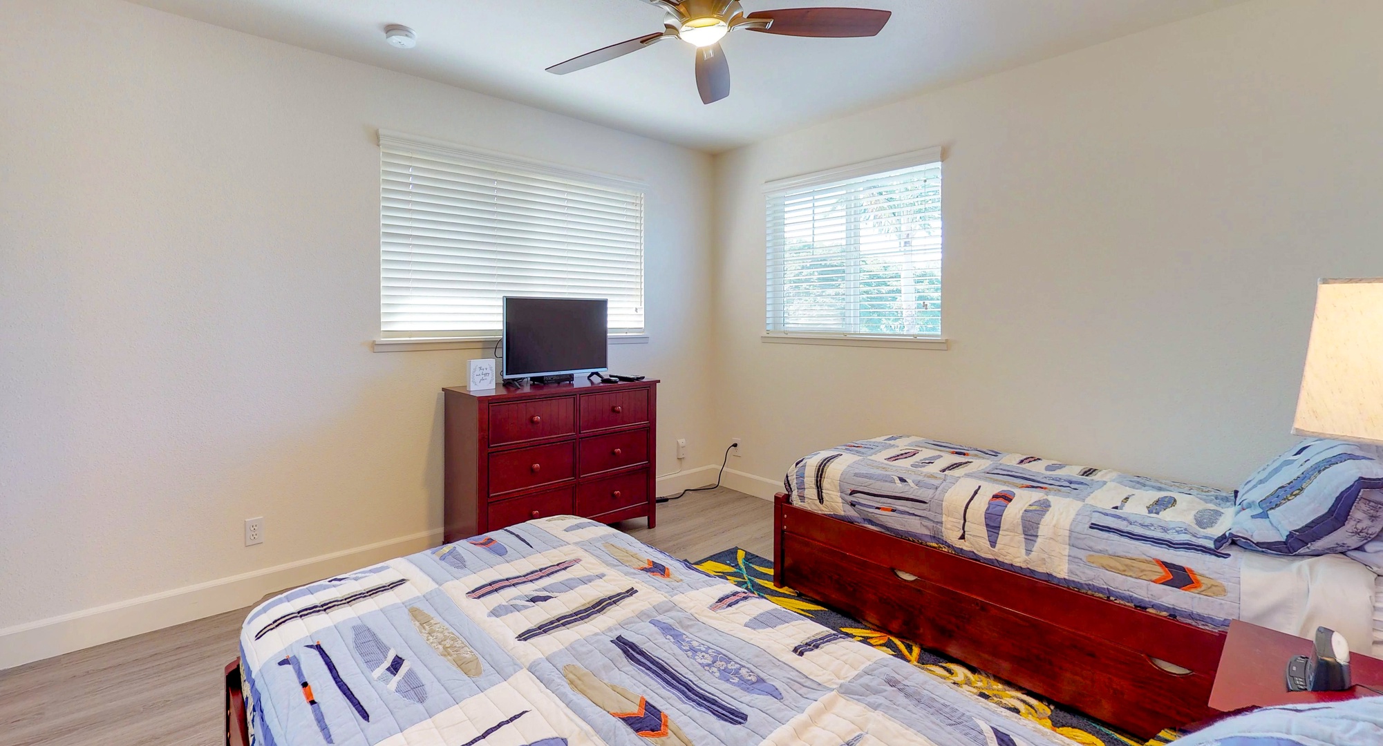 Kapolei Vacation Rentals, Ko Olina Kai 1051D - The third guest bedroom with a TV and natural lighting.