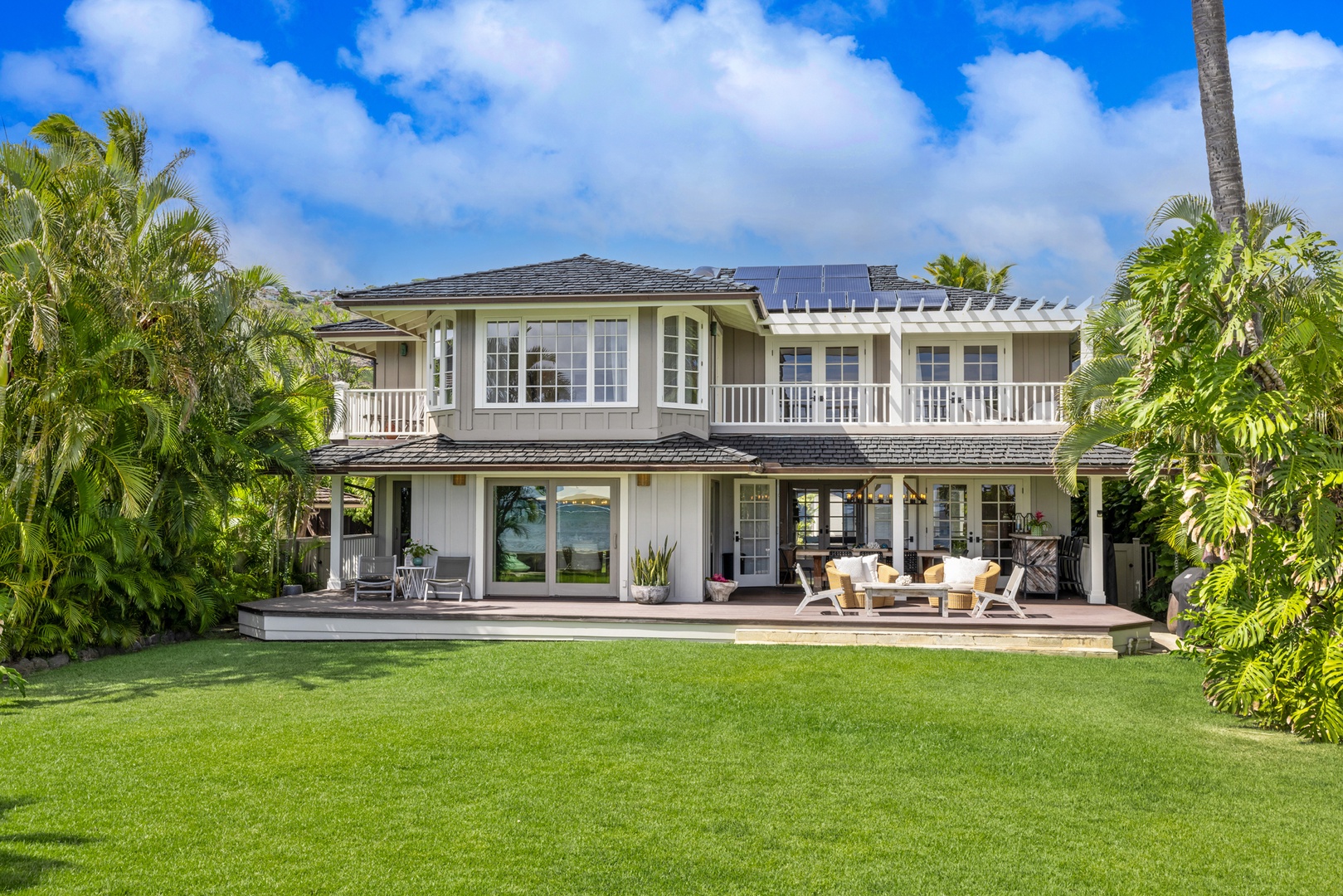 Honolulu Vacation Rentals, Moana Lani - Main House - Wander out to the far edge of the lawn for a look back at the house and its upstairs veranda.