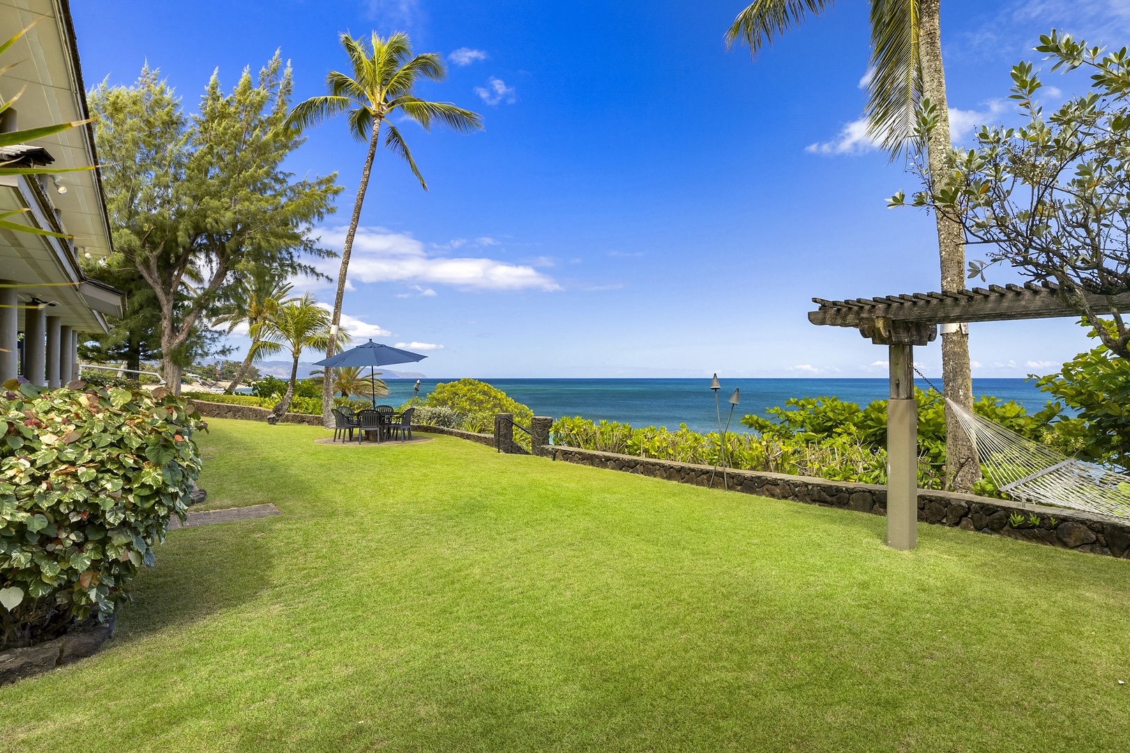 Haleiwa Vacation Rentals, Hale Kimo - Lush green private back yard, with panoramic ocean views