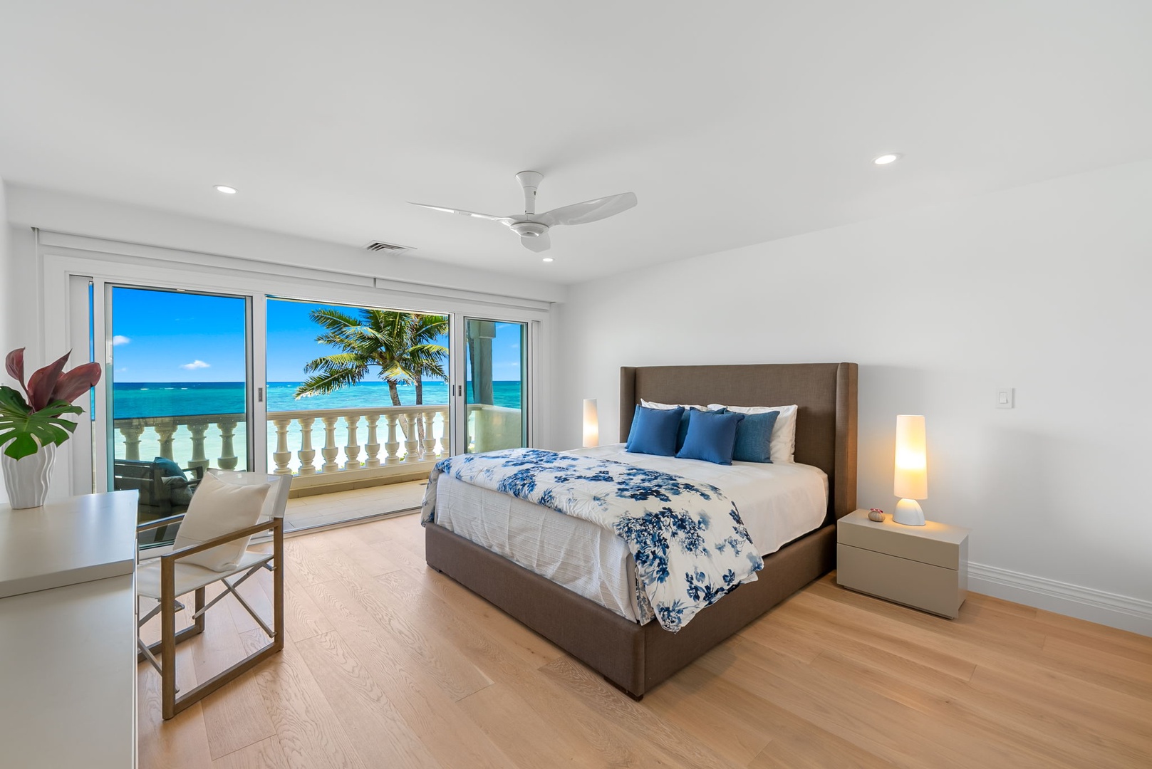 Kailua Vacation Rentals, Lanikai Sunrise Estate - Oceanview guest suite with king bed, elegant touches, and floor-to-ceiling views of Lanikai’s shore.