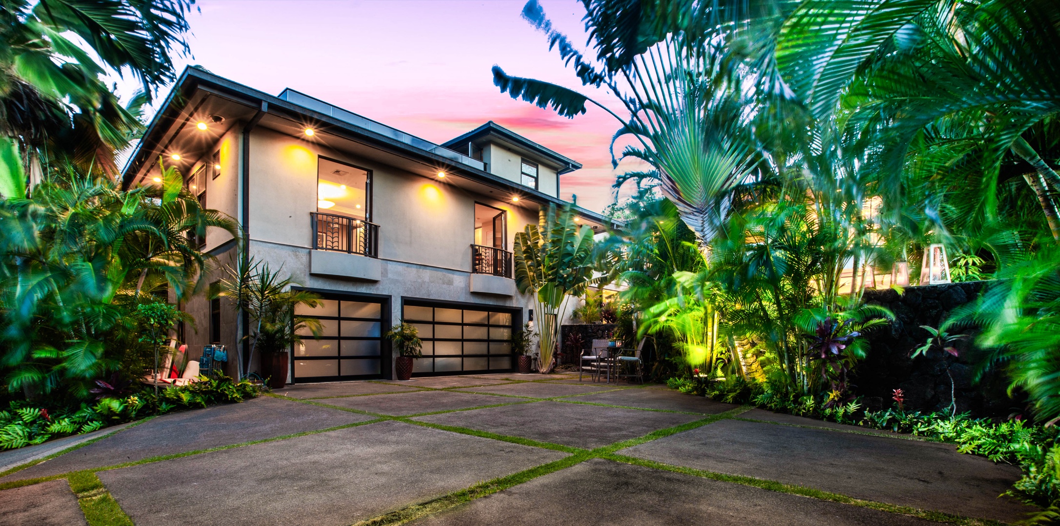 Honolulu Vacation Rentals, Pili Pono - Front driveway with garage and dramatic evening uplighting.