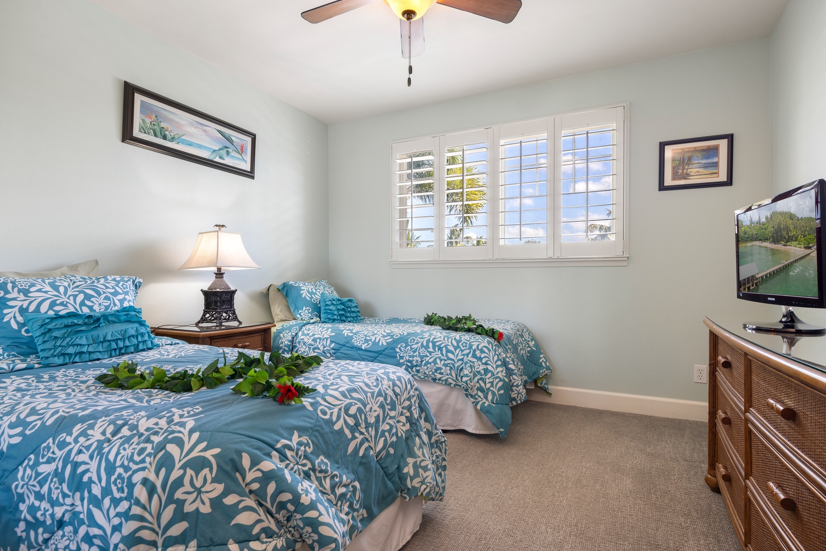 Drift off in your serene twin bedroom where coastal blues and fresh florals create the perfect island retreat atmosphere.