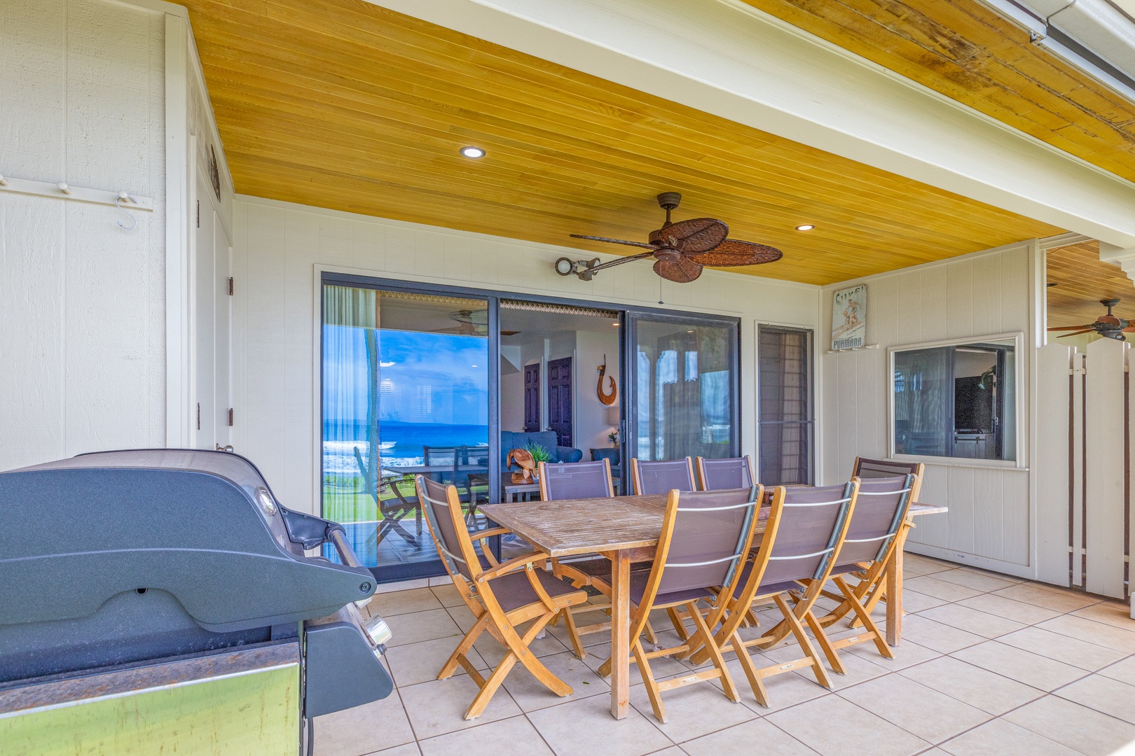 Lahaina Vacation Rentals, Puamana 254-2 - Puamana 254-2’s downstairs lanai offers seating for eight, a gas grill, and beach storage for essentials.
