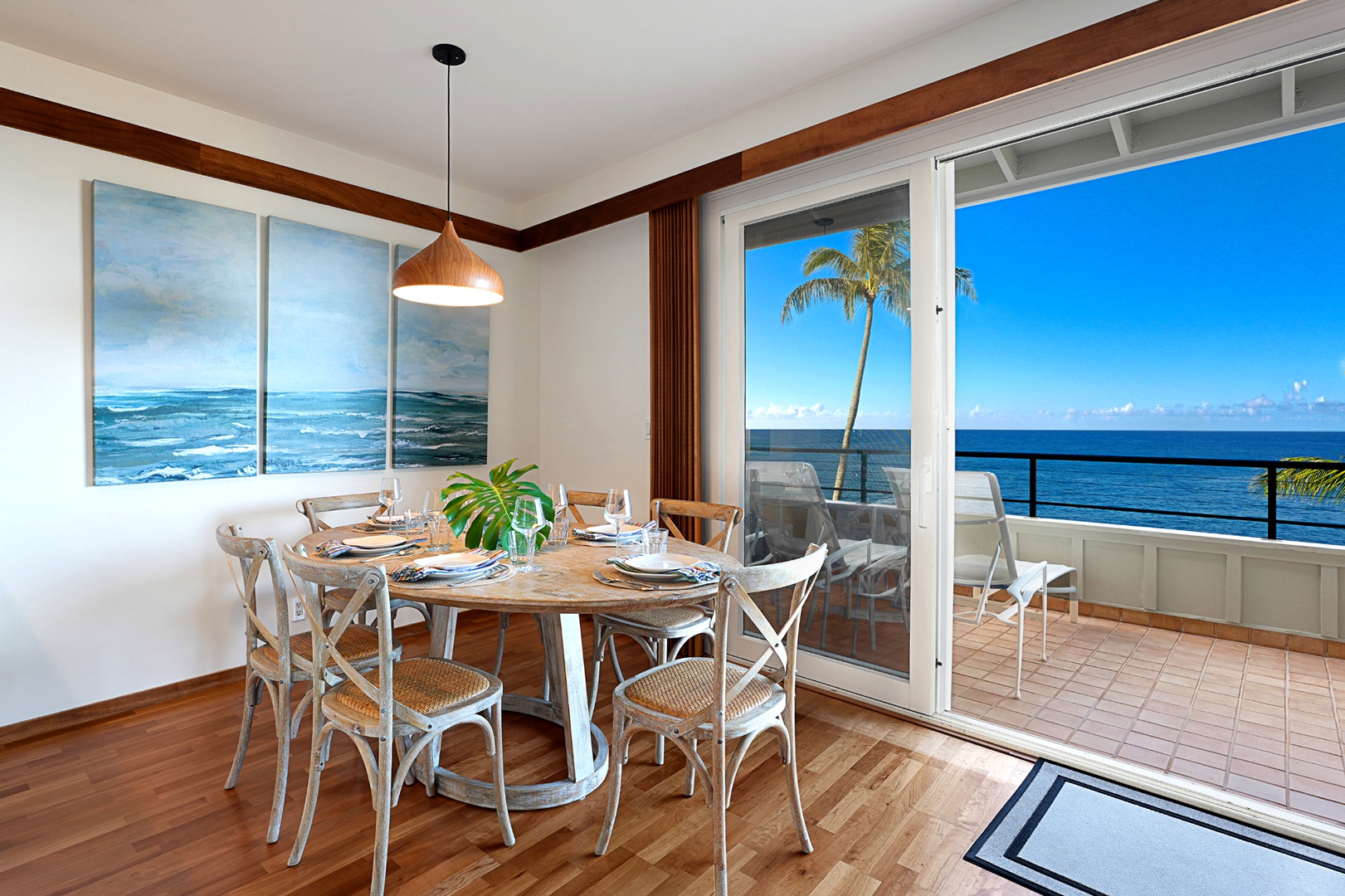 Koloa Vacation Rentals, Whalers Cove #133 - Dine with a view—seating for six by the floor-to-ceiling oceanfront windows.