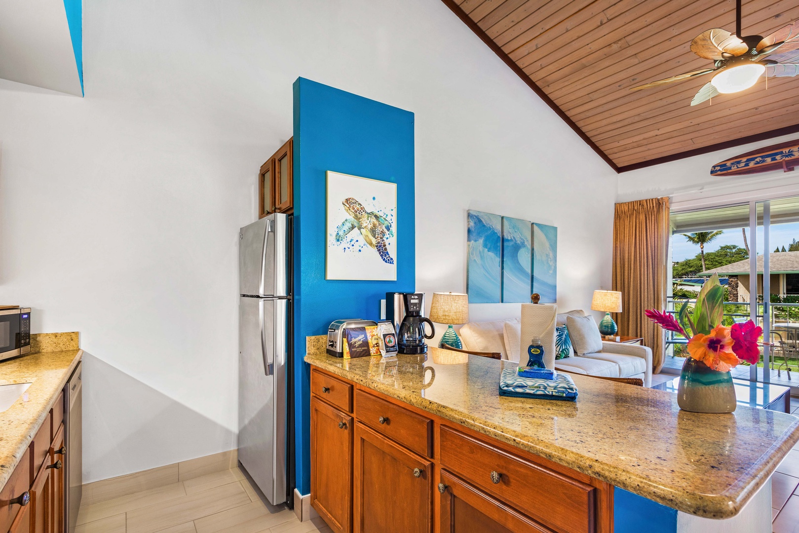 Lahaina Vacation Rentals, Napili Shores F-252 - Bright and colorful kitchen with modern appliances and an open layout, perfect for preparing meals while enjoying the lively atmosphere of the living area.