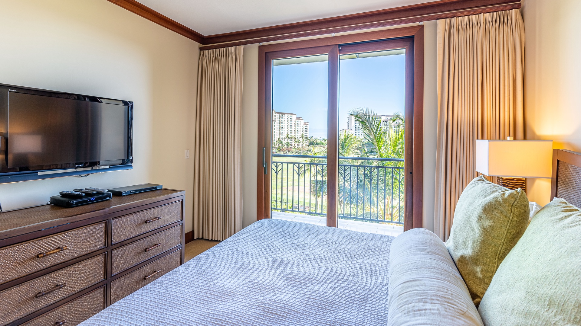 Kapolei Vacation Rentals, Ko Olina Beach Villas B505 - The primary guest bedroom with TV and a view.