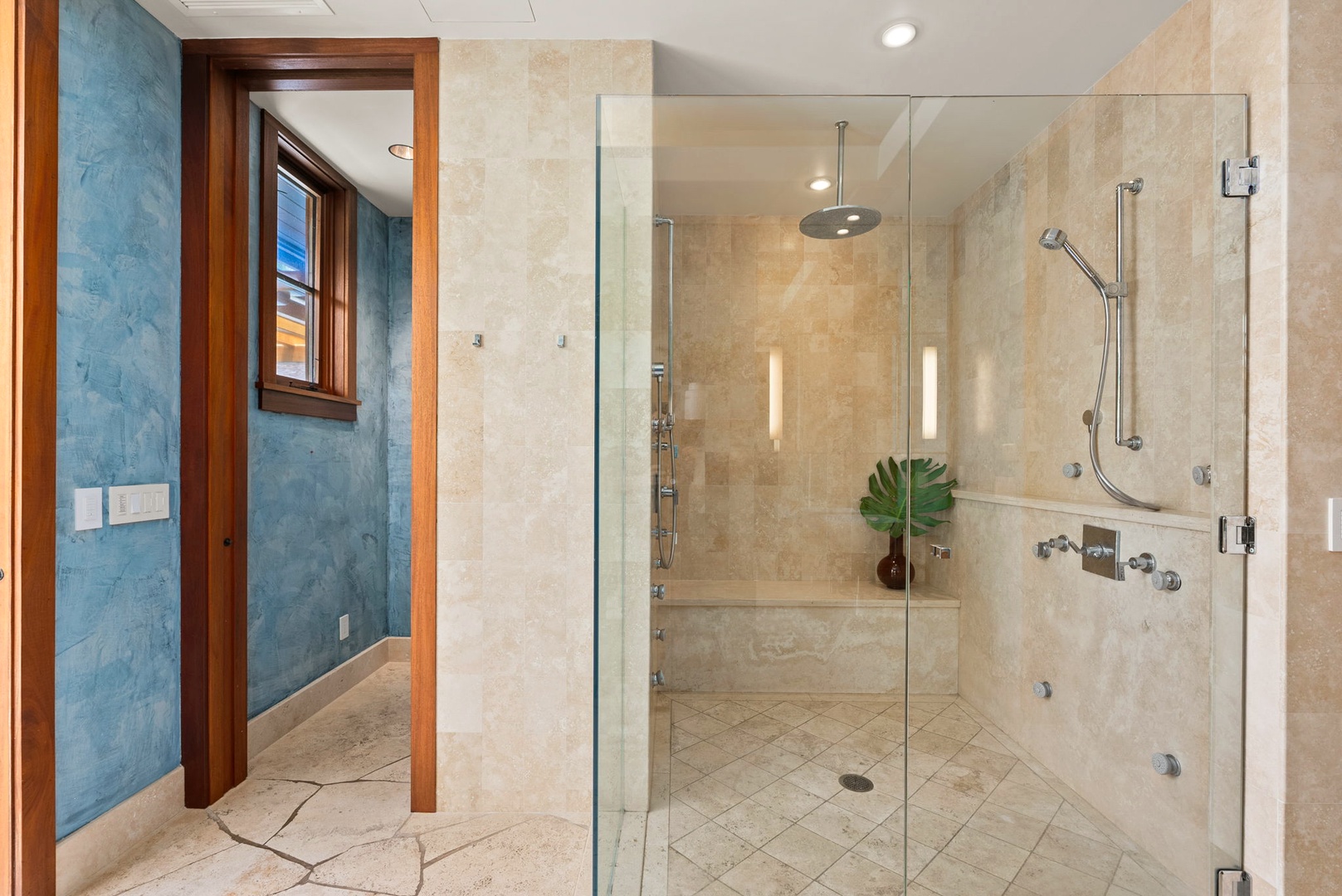 Kailua Vacation Rentals, Kailua Sands - Walk-in shower with glass enclosure in primary ensuite.