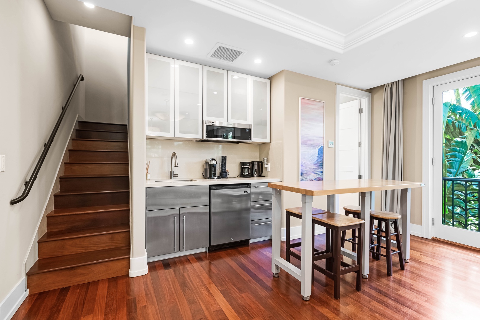 Honolulu Vacation Rentals, Pili Pono - Studio kitchenette with bar seating, stainless appliances & compact style.
