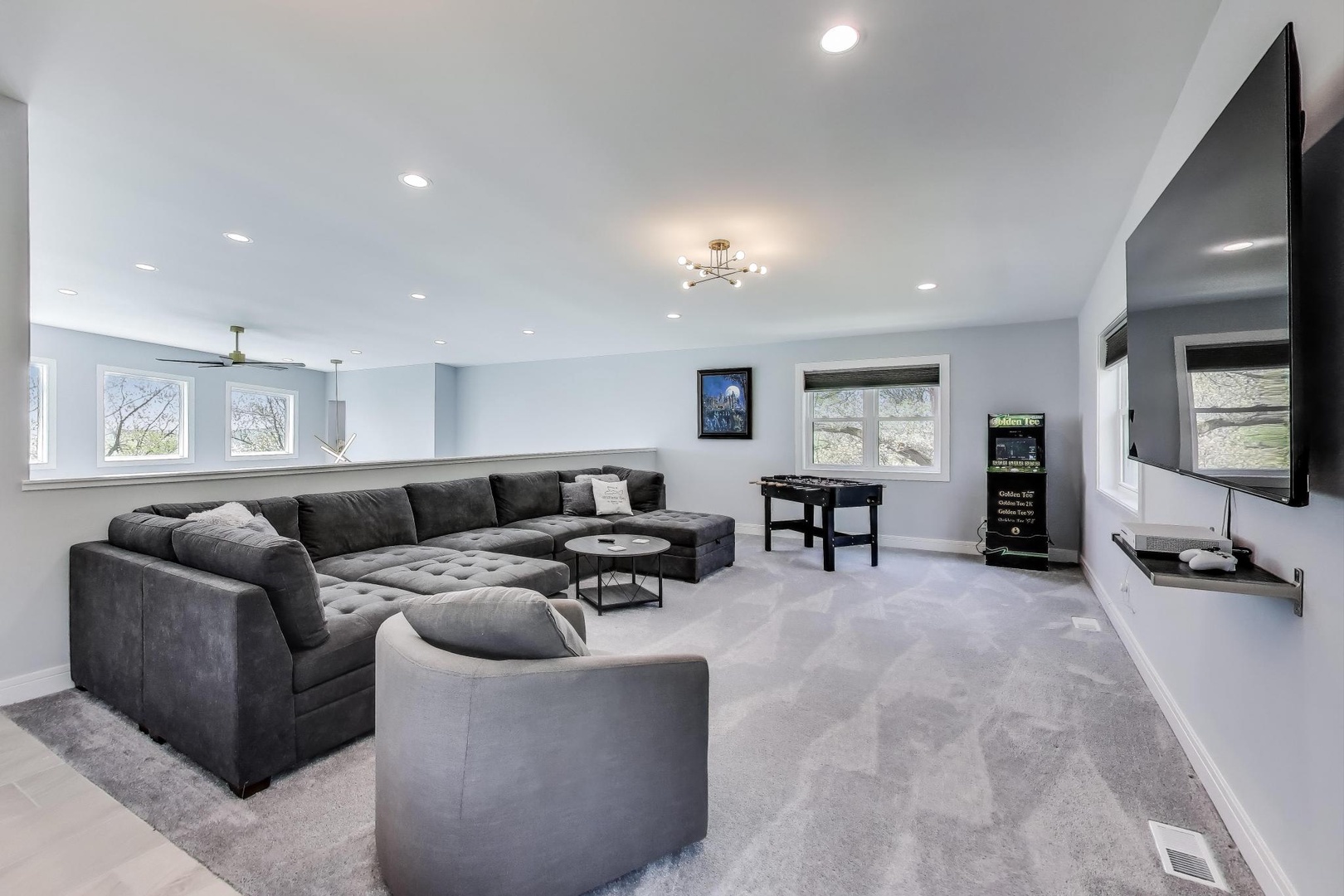 Large Sectional on Loft with Foosball and Golden Tee